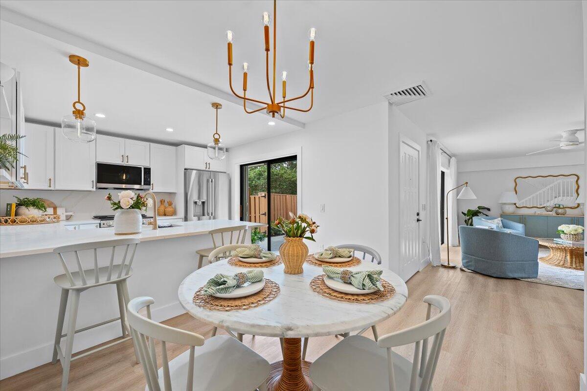 Live the coastal lifestyle you've been dreaming of in this new Simmonds-Signature renovation home! This 2BD/2.5BA coastal villa is just minutes from Jupiter's most beautiful beaches. This villa has been transformed from top to bottom and lives like a modern coastal retreat. Enjoy a brand new kitchen, beautifully redesigned bathrooms, new flooring throughout, updated lighting, and thoughtful designer touches that elevate every room. Everything is 'new', fresh and delightful! Light & bright with ocean breezes & perfect exposure. Looking for the perfect winter getaway? This is Jupiter living at its best in this price point. 1 Dog allowed under 25 pounds & no renting during the 1st 18 months of ownership. This home is located minutes to all amenities one could hope for. Close to shopping, dining, boutiques, nature trails & just 25 minutes to PBI airport. Live the simple life here, or purchase as a 2nd home or future seasonal rental (Once owned for 18 months, rentals are allowed). HOA fees cover all landscaping, community pool, pickball, management, reserves, cable, exterior of building and roof maintenance. Don't miss this delighful villa in one of the best coastal town in FL!