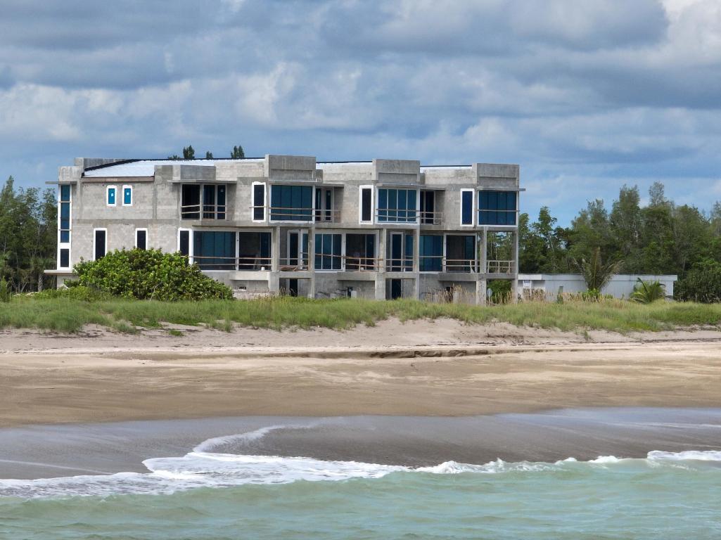 Brand new luxury home enclave nestled between the turquoise Atlantic Ocean & Intracoastal offers unparalleled seaside living. Each home is an oceanfront masterpiece, mere steps from your private beach. This stunning 3-story residence spans 3,911sqft, meticulously designed to maximize breathtaking ocean views. Floor-to-ceiling windows & expansive outdoor terraces blur the line between indoor & outdoor living. Dive into your gas-heated pool & elevate your living experience w/luxury finishes, top-of-the-line appls, & elevator. Pets are welcome in this gated community w/clubhouse & kayak/day dock.