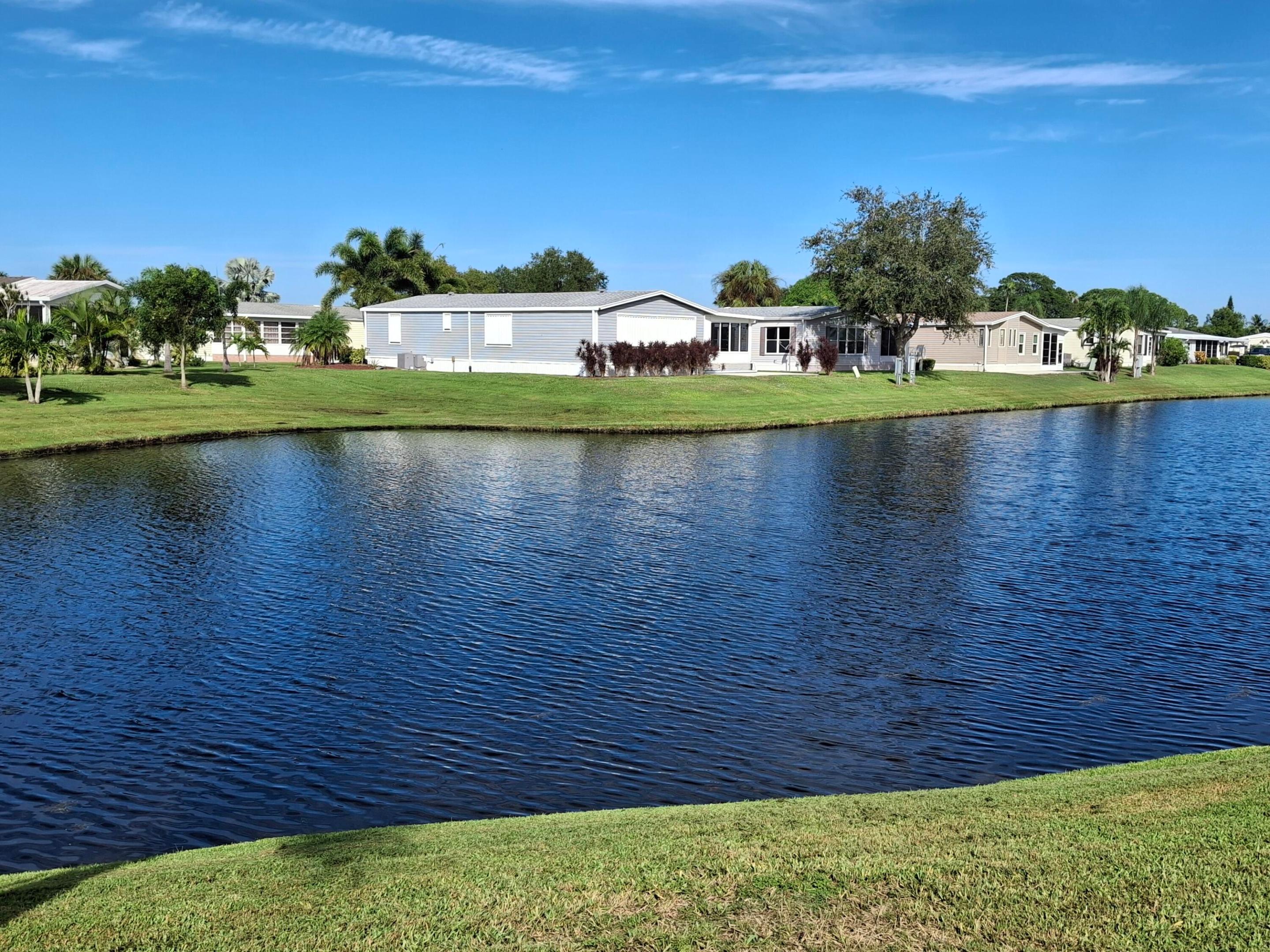 RARE THREE bedroom two bath home on the water. ROOF ( 2021), AC (2022) Granite countertops in kitchen, tile flooring in main living areas with Luxury Vinyl Plank flooring in the bedrooms. Formal dining area and an eat in kitchen area. Soak up the water view with your morning coffee in the dinette, or outdoor lanai. HOA includes internet, cable and trash. Savanna Club is an active 55+ community boasting an 18-hole golf course, 3 clubhouses with pools, 3 exercise rooms, pickleball, tennis, bocce, shuffleboard and more! Numerous clubs and HOA activities to participate in. Be as busy as you want to be. Savanna Club is a lovely manicured community within 10 minutes to the hospital and physicians offices, 15 minutes to the beach and Aldi's at our entrance for groceries. Land Leased Home