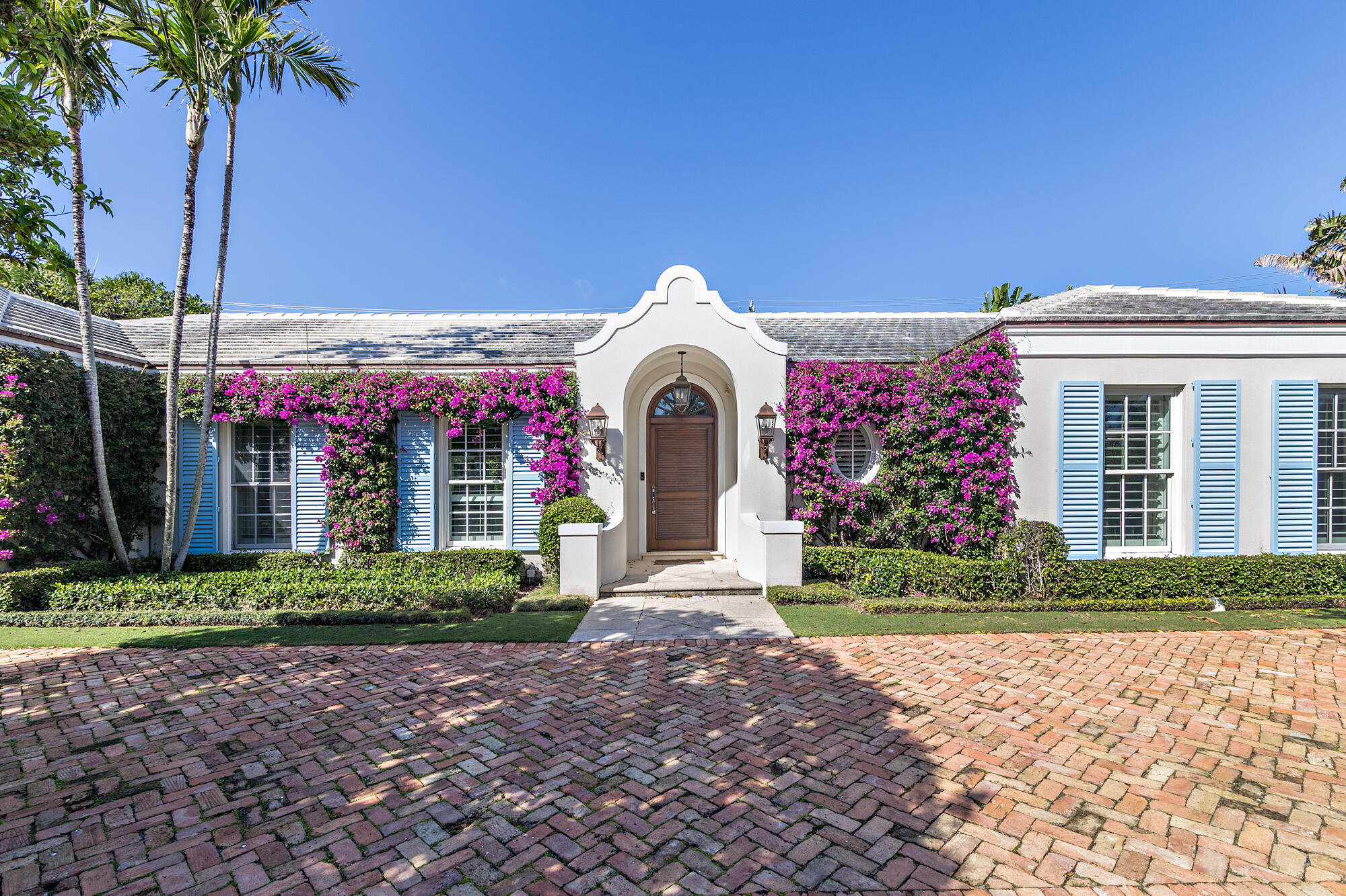 West Indies style home with 3 bedrooms, 3 bathrooms + Den/Office in the highly sought after North End. High ceilings, eat-in kitchen, guest suite, and marvelous covered outside loggia opens to the pool and garden area.  Walking distance to beach and lake trail make this home quintessential palm beach living.