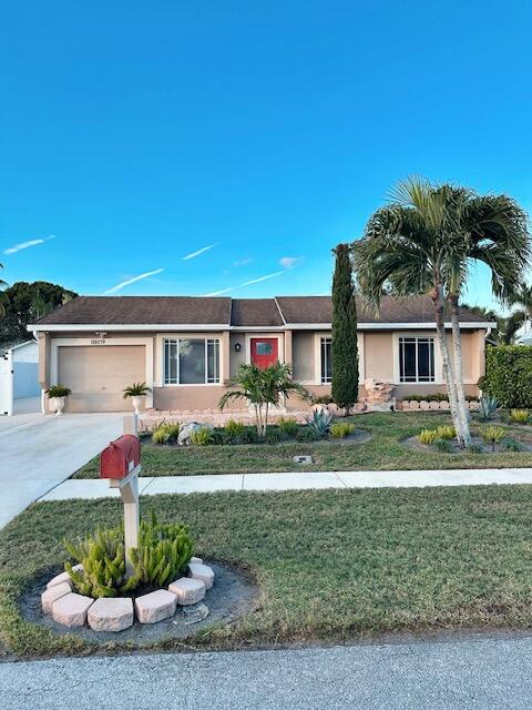 Welcome to this beautifully maintained and meticulously cared-for home, ideally located in a central and convenient area. This inviting property features 3 spacious bedrooms, 2 full bathrooms, a comfortable living room, and a separate family room perfect for entertaining or everyday living.  Enjoy Florida living at its finest with a screened patio complete with an outdoor kitchen, overlooking a beautifully landscaped and well-maintained backyard. Inside, you'll find tile flooring throughout, along with tastefully updated kitchen and bathrooms that add both style and functionality.  Pride of ownership is evident throughout this move-in-ready home, a true gem that has been exceptionally well cared for.
