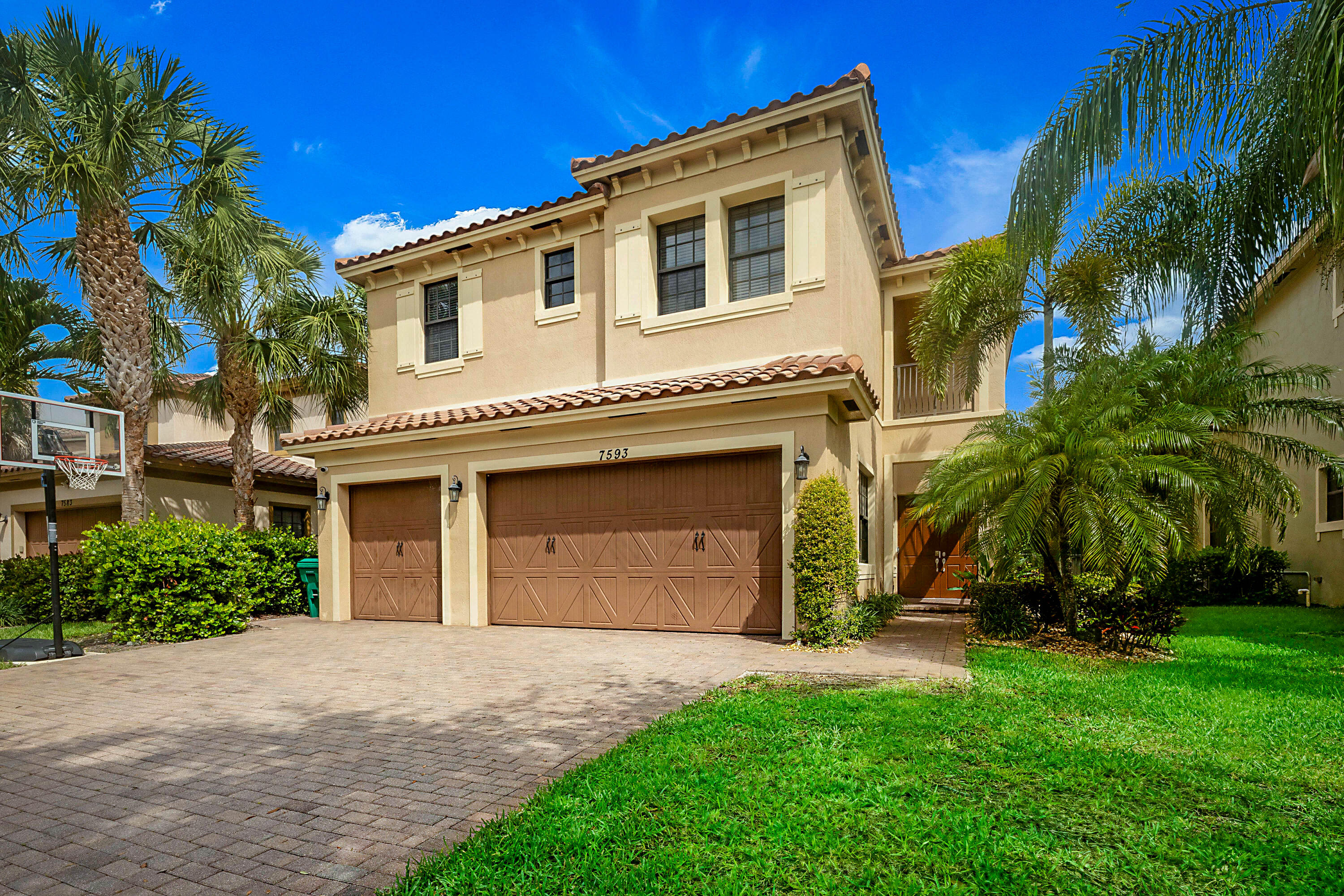 Perfectly positioned in one of Parkland's most desirable neighborhoods, this spacious 5-bedroom, 4-bathroom pool home offers over 3,300 square feet of living space and an unbeatable location just a few homes from the walking path to Heron Heights Elementary School. Designed for both comfortable everyday living and entertaining, the first floor features a formal dining room, cabana bath, laundry room, and an expansive family room that opens seamlessly to the kitchen. Upstairs, you'll find a highly sought-after layout with two primary suites and two additional bedrooms connected by a Jack-and-Jill bathroom, providing flexibility for multigenerational living, guests, or growing families. Step outside to your own private backyard retreat featuring a screened saltwater pool with sun shelf and waterfall, built in 2015, along with a fenced dog run and plenty of space to enjoy South Florida's year-round sunshine. Additional highlights include impact windows and doors throughout, generator hookup, a 2021 water heater, ceiling fans in every bedroom, and a spacious 3-car garage. Residents enjoy one of the lowest HOA fees in Parkland, along with access to a community pool, beautiful parks, and an amphitheater all within walking distance. Conveniently located near top-rated schools, shopping, dining, and recreational amenities, this home presents an exceptional opportunity to enjoy the Parkland lifestyle at an incredible value. Don't miss your chance to make this beautiful home your own.