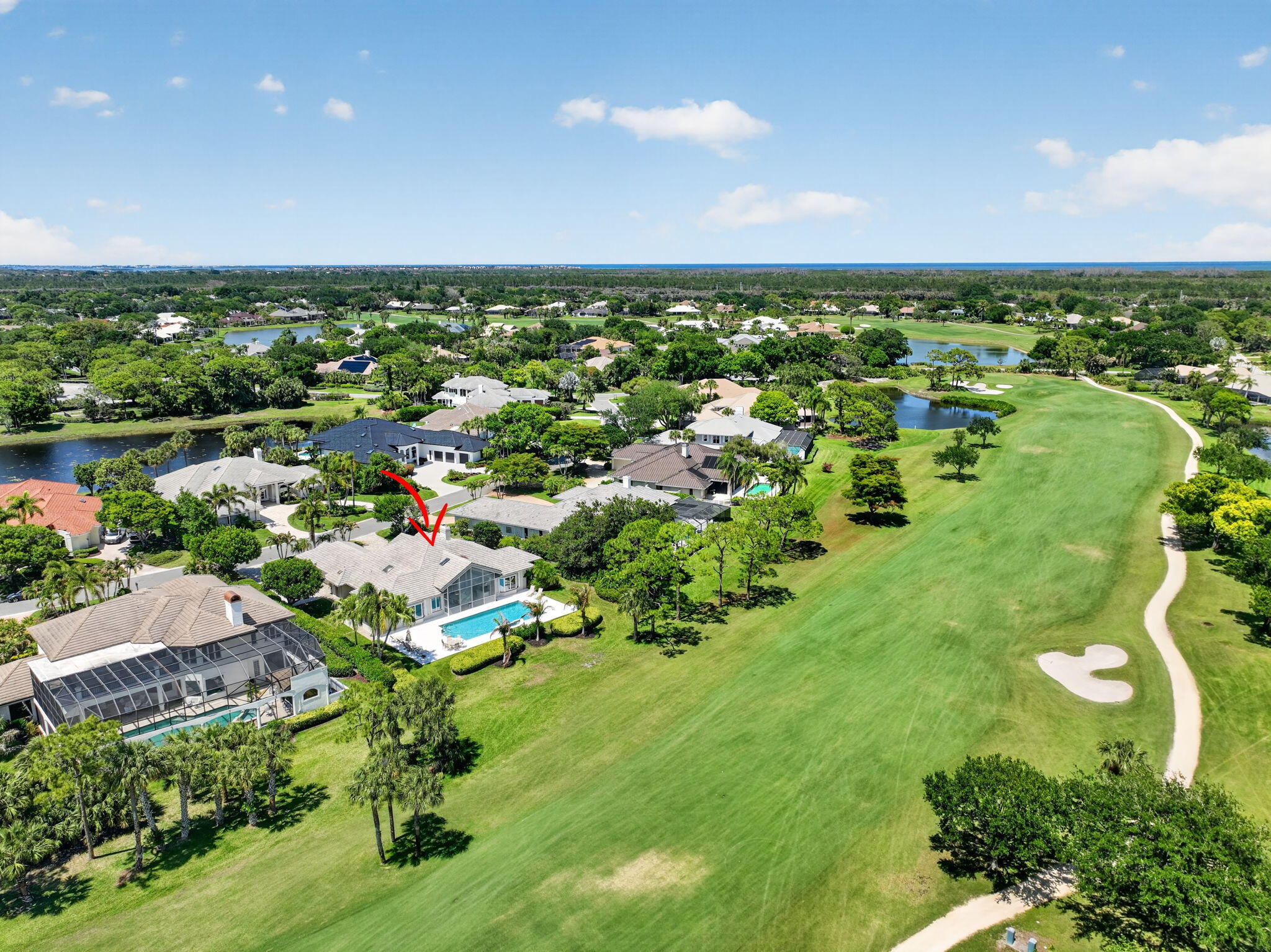 Welcome to luxury living in the prestigious Mariner Sands Country Club, one of the Treasure Coast's most sought-after private golf communities. Perfectly positioned on highly desirable Barrington Drive, this exceptional residence offers 3 bedrooms, 3 full baths, and 2 half baths across 3,485 square feet of thoughtfully designed living space. Modern comforts include concrete block construction, a whole-house generator, tankless water heater, and a 3-car garage with epoxy flooring. The kitchen features a gas cooktop, double ovens, Sub-Zero refrigerator, and generous storage, flowing seamlessly into a spacious family room.  The living room opens effortlessly to a screened lanai overlooking a stunning pool, expansive patio, and sweeping golf course views.  Primary suite is a private sanctuary with dual walk-in closets, double vanities, jacuzzi tub and walk-in shower. Two generously sized guest rooms each have an ensuite bath.  The dining room is currently being used as an office and art studio. The laundry room has an extra-large storage closet, cabinets and sink. Residents enjoy two championship 18-hole golf courses, Har-Tru tennis courts, pickleball, croquet, and a state-of-the-art fitness center. The community also features a resort-style pool with a separate lap pool, along with the Sand Bar offering exceptional indoor and outdoor casual dining. The spectacular new clubhouse provides both fine and casual dining, along with weekly social events and happy hours. Additional amenities include a dog park, playground, spa, and nail salon—all just minutes from pristine beaches and charming downtown Stuart. Social membership is required with a one-time capital contribution of $50,000 due at closing. Golf membership is separate and optional.