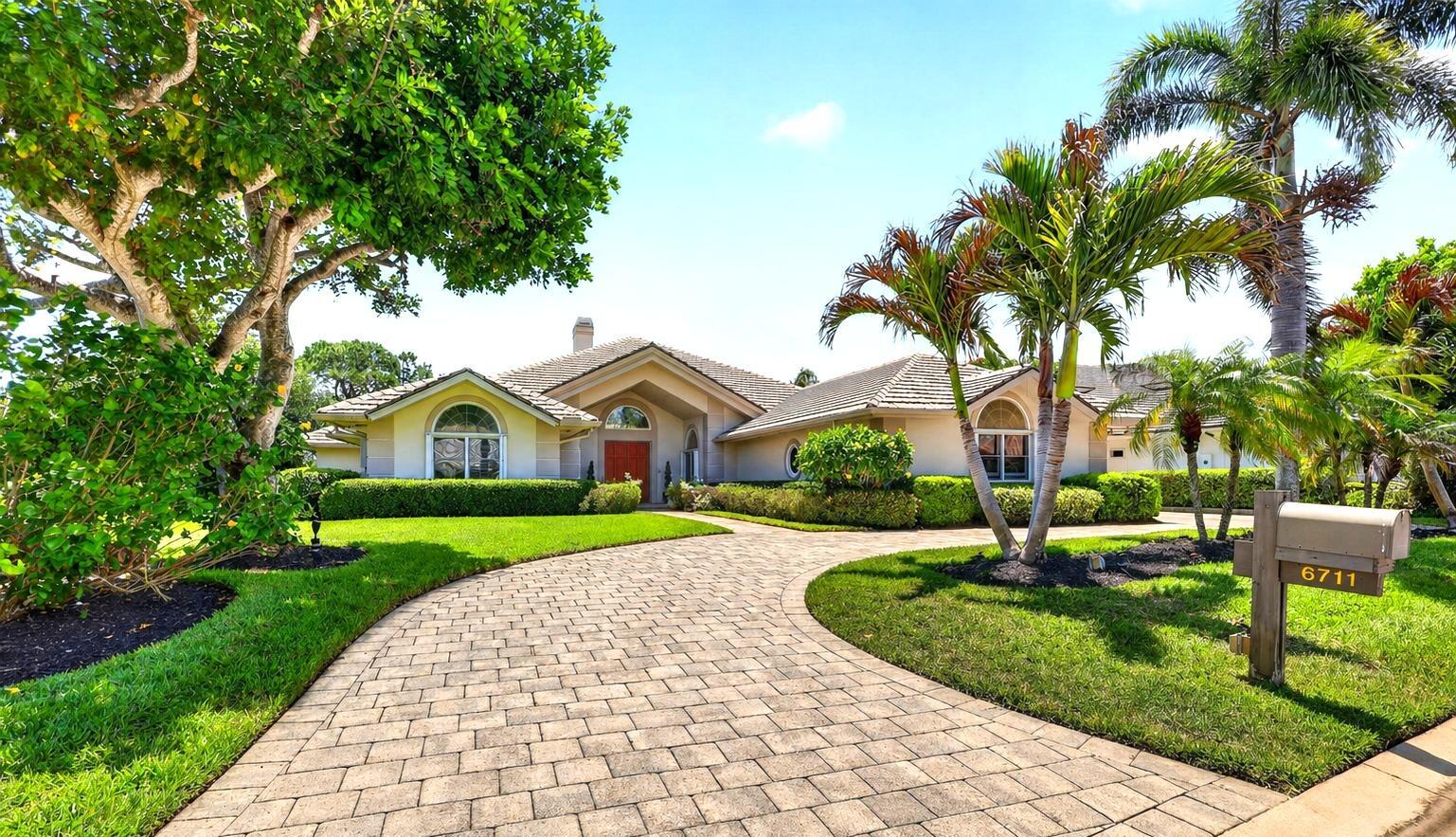 Located in the exclusive golf community of Mariner Sands Country Club, this beautiful 3,485 square foot home offers 3 bedrooms, 4 bathrooms and breathtaking golf course views! The home is concrete block construction and has a whole-house generator, tankless water heater, and a 3-car garage with epoxy flooring. The kitchen features a gas cooktop, double ovens, Sub-Zero refrigerator, and generous storage, flowing seamlessly into a spacious family room.  The living room with gas fireplace opens effortlessly to a screened lanai overlooking a stunning pool, expansive patio, and sweeping golf course views.  Primary suite is a private sanctuary with dual walk-in closets, double vanities, jacuzzi tub and walk-in shower. Two guest rooms each have an ensuite bath.   A generously sized bonus room currently used as an office and art studio offers endless possibilities. Perfect as a den, media room, or formal dining space, with ample room to accommodate a pull-out sofa for additional guests. Residents enjoy two championship 18-hole golf courses, Har-Tru tennis courts, pickleball, croquet, and a state-of-the-art fitness center. The community also features a resort-style pool with a separate lap pool, along with the Sand Bar offering exceptional indoor and outdoor casual dining. The spectacular new clubhouse provides both fine and casual dining, along with weekly social events and happy hours. Additional amenities include a dog park, playground, spa, and nail salon—all just minutes from pristine beaches and charming downtown Stuart. Social membership is required with a one-time capital contribution of $50,000 due at closing. Golf membership is separate and optional.