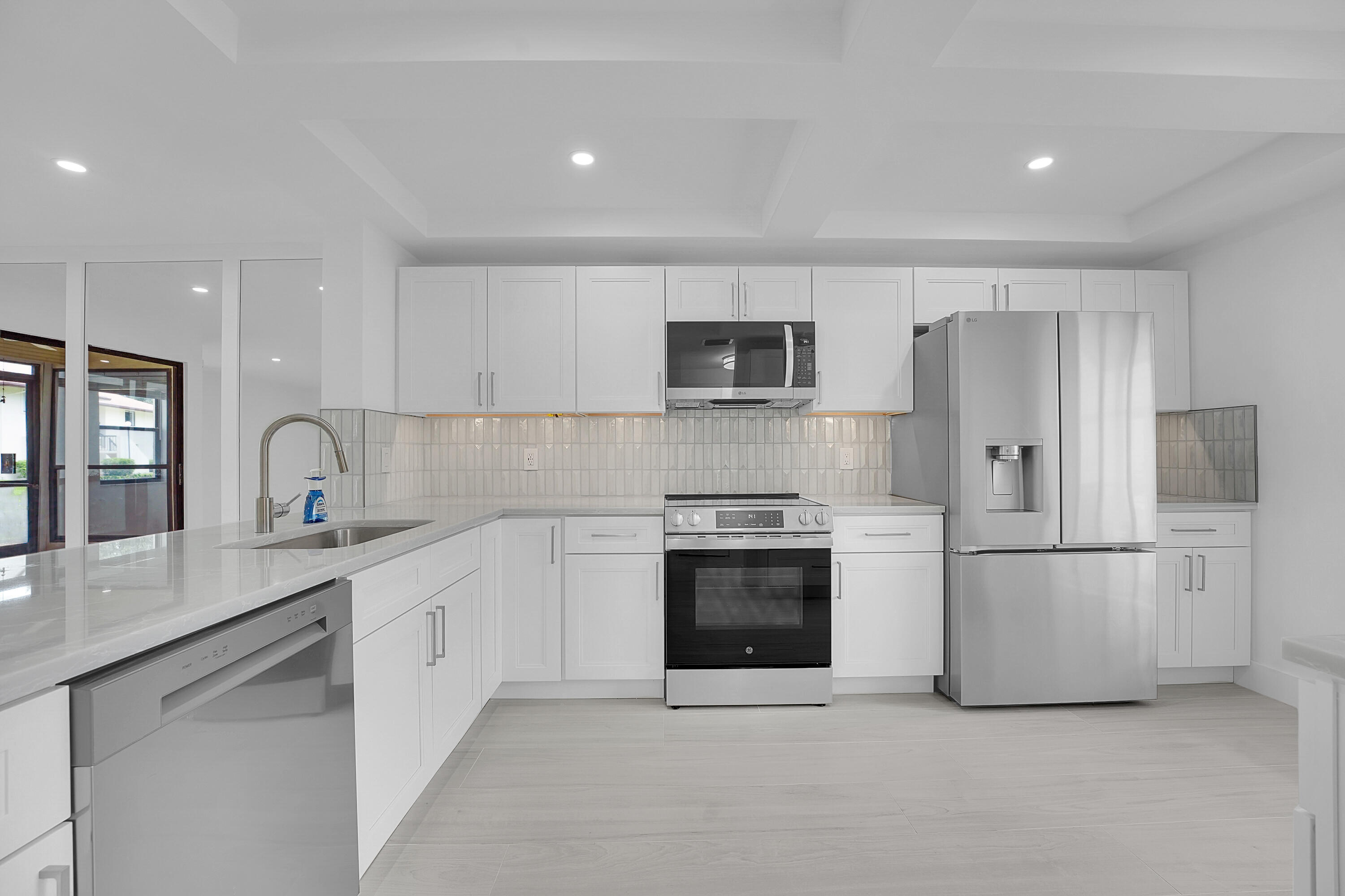 Forget the typical "fixer-upper"—step into the highest-standard renovation available in Park Pointe. This stunning 2-bedroom, 2-bathroom first-floor residence has been reimagined from the studs up with no expense spared. Perfect for the buyer who demands luxury finishes without the $300k price tag. Rare high-end Quartz countertops, custom cabinetry, and a suite of brand-new, premium stainless steel appliances. Modern flooring throughout (no carpet!), recessed lighting, and fully updated spa-like bathrooms. All heavy lifting is done. Fresh paint, new fixtures, and a layout designed for effortless Florida living. Enjoy the security and social life of Park Pointe, a premier 55+ community. This unit is situated on the first floor (no stairs/elevators) and is just steps away from amenities!