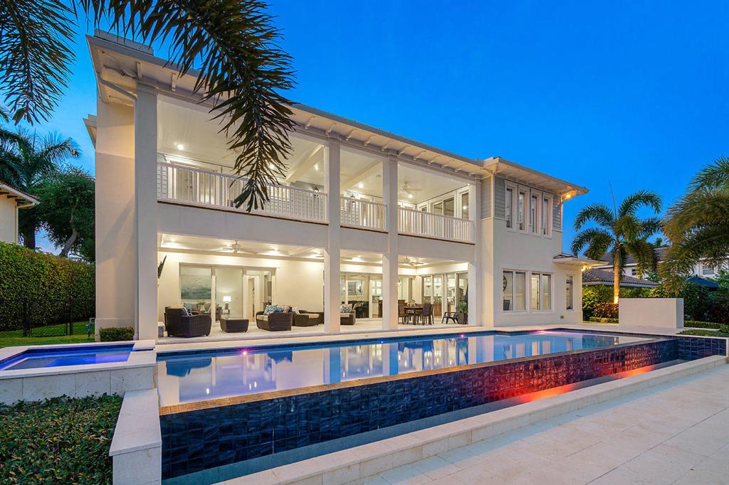 Magnificent  custom-built  Key West tropical style estate home with Southern exposure and over 100' of waterfront and 80' of dock space in highly sought after Lake Rogers. This spectacular home was built in 2016 with all the finest finishes, designer features, and the utmost attention to detail.  5 bedrooms (all en-suite) plus a den and loft, 6.5 full baths, a custom kitchen, private elevator, two large patio areas with gas fireplaces, an incredible outdoor oasis with large salt water infinity pool, spa, sunshelf, and lots of entertaining space. Additional upgrades include a metal roof, circular driveway,impact windows and doors, electronic screens, custom closets, Sonos stereo system, central vac, a boat lift,  rack for up to 4 kayaks/ paddleboards, built-in outdoor grill & so much more! Less than a mile walk to the beach. Bring your fussiest buyers to enjoy South Florida living at its best! 

Virtual walk through using Matterport:https://my.matterport.com/show/?m=VPKtqubvtw3