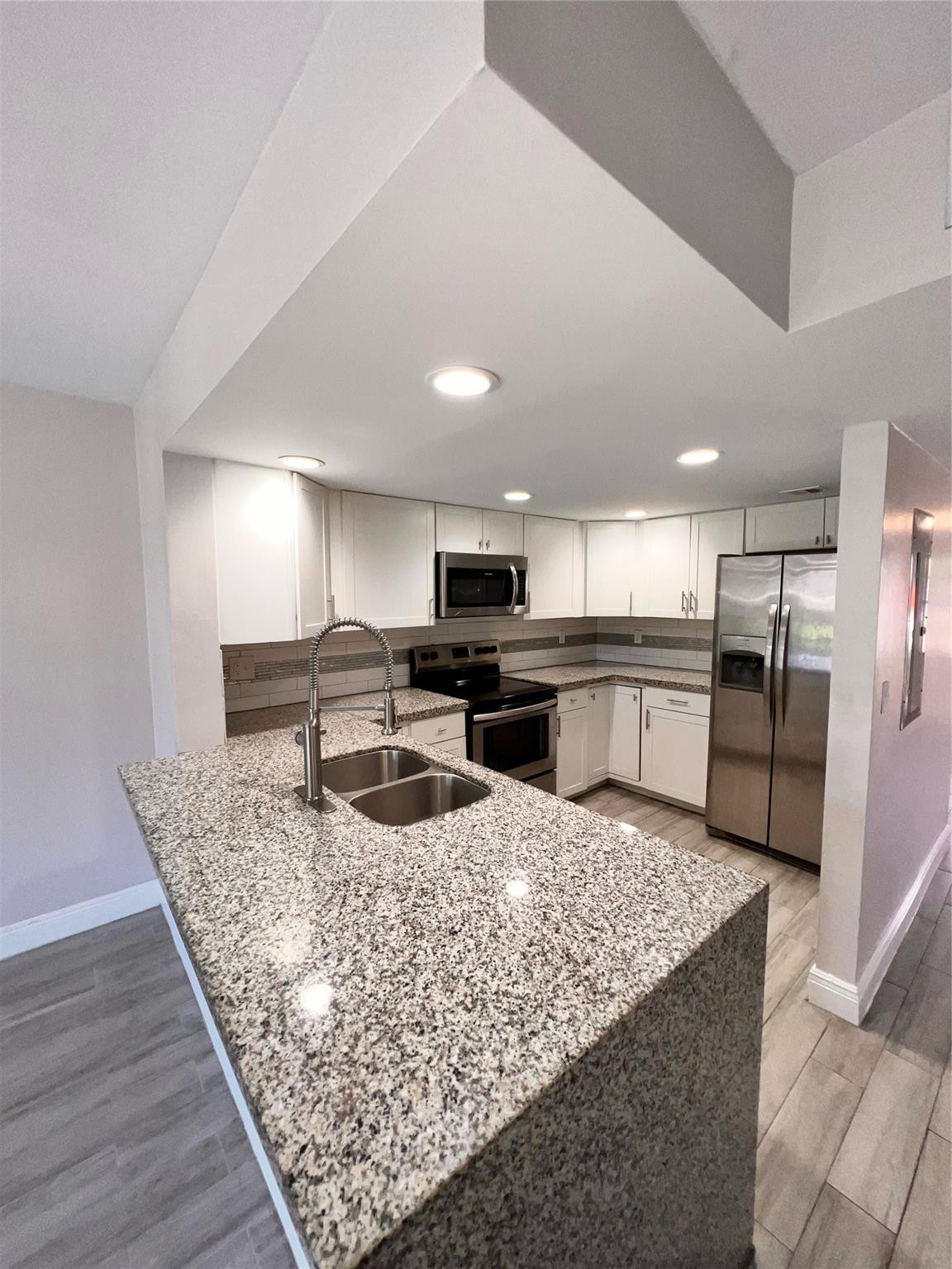 Discover refined comfort in this beautifully appointed 3-bedroom, 2.5-bathroom townhouse, ideally located near top-rated schools, premier hospitals, and an array of shopping and dining destinations. Spanning approximately 1,500 square feet of thoughtfully designed living space, this elegant two-story residence showcases sleek porcelain tile flooring, stainless steel appliances, and an upgraded washer and dryer, blending style with everyday convenience.  Designed for both comfortable living and effortless entertaining, the spacious floor plan offers versatile living areas filled with natural light. Nestled within the desirable Country Village community, this exceptional home will be available for move-in by September 1, 2026.  Water and sewer are included in the rent and paid by the owner. Showings only available Monday through Friday between 9:00 AM to 6:00 PM, and must be scheduled in advance.