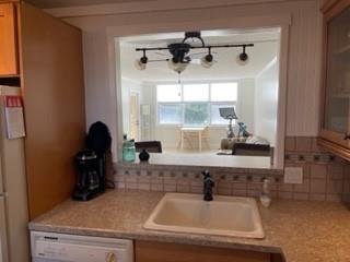 Beautiful, spacious one bedroom condo overlooking the pool, BBQ and shuffleboard area!  Updated kitchen and bath, tile floors throughout, balcony, and lots of closet space!  Impact windows and door!  Walking distance to the very popular Pompano Beach and Pier scene!  Restaurants, bars, shops, outdoor fitness area, playground, library, and the beach just steps away!!  Parking space close to building! The building's 40 year inspection has been completed!