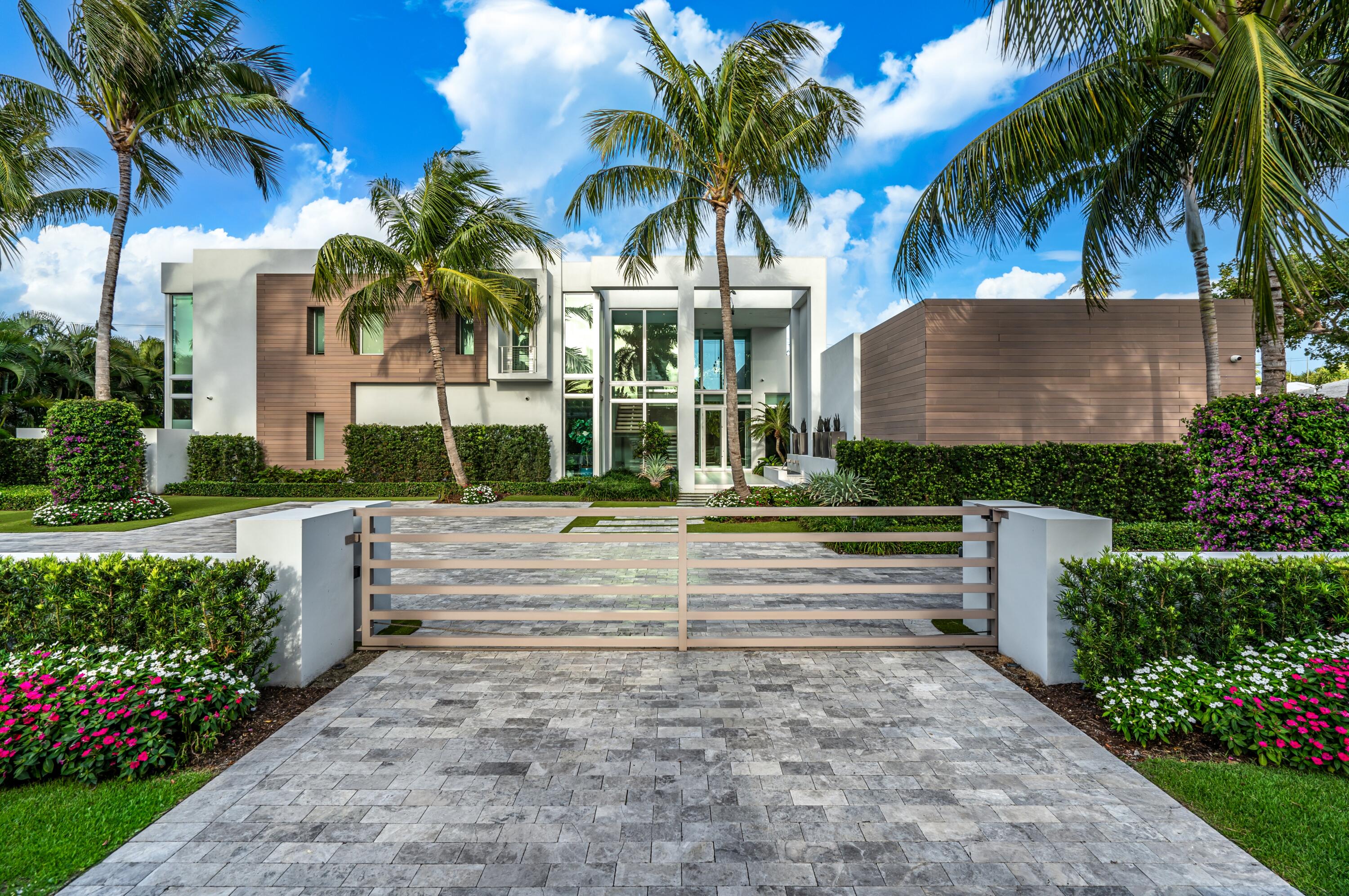 Buyer pays title insurance, Florida documentary stamps, and all other closing costs.

A striking architectural statement, this modern showplace encased in glass window walls seamlessly blends indoor and outdoor living with the finest designer finishes. 

At the pinnacle of modern and luxurious, famed architect George Brewer with Signature Building Group masterfully originally created this one-of-a-kind estate. Covered in expansive window walls and innovatively designed, each room allows guests to feel enveloped in the tropical grounds that surround this artistic residence. The lavish combination of interior designer finishes and expansive outdoor living defines this residence that presides in Boca Raton's oldest, most prestigious Estate Section. This sleek estate is a new world unto itself; sited on a sprawling 150± feet by 150± feet parcel is a rare find in this beachside enclave. World-class beaches, The Boca Raton and Mizner Park are all in close proximity to this iconic neighborhood. 

Perfectly intimate for a family or grand enough for meeting the needs of an entertainer, this 5-bedroom maison totals 7,956± square feet. Affording ultimate privacy, a walled and gated motor court accompanies the dramatic architectural structure entry with a magnificent water feature leading to the glass-encased foyer. Lush greens create a garden ambiance that can be admired from every sun filled room in this spacious residence. Oversized 12-foot sliders tie together the indoor living spaces to the outdoor oasis featuring a covered loggia, a stand-alone summer kitchen, resort-style pool and spa. 

Location:
Cocoanut Road, Boca Raton, Florida.  Known as the jewel in the crown of Boca Raton, The Estate Section is a sought-after beachside enclave across from the world-renowned The Boca Raton, close to Mizner Park's fine shopping and dining. 

Property: 
Commanding a vast sought after 150± feet by 150± feet lot, this modern masterpiece was built on park-like grounds between the Intracoastal and the Atlantic Ocean. The walled and gated motor court is flanked by manicured tropical landscaping and is finished with a dramatic water feature entrance. Suited for large gatherings, the outdoor living space features a covered loggia, a separate pavilion with summer kitchen with a grill and patio overlooking the sun-splashed pool with a spa. A private garden shower can be found off of the master suite. 

Residence: 
This two-story residence totals 7,956± square feet featuring 5 bedrooms, 5 full and 1 half baths, and a 3-bay garage. The glass-encased foyer is finished with imported Italian porcelain floors that carry throughout the main living areas of this natural light infused estate. Floor-to-ceiling glass sliders and window walls encompass the open floor plan residence. 


First Floor:
Guests are welcomed into the impressive glass-encased foyer with imported Italian porcelain floors, hosting a free-floating staircase to the left and landscaped atrium to the right. Beyond the foyer hallway, 12± feet impact glass sliders surround the open family room, dining area, and chef's kitchen that seamlessly extend to the covered loggia with automatic hidden screens. Fashioned with the finest modern luxury Italian designs, this spectacular chef's kitchen features Caesar stone and quartzite counters, a gas oven and stove, Miele appliances, and custom cabinets. Equipped for hosting, the chef's kitchen offers an elongated island with bar seating. A powder bath, walk-in pantry, and laundry room are adjacent to the kitchen. An impressive clubroom that provides access to the patio can be found to the left of the foyer. Continuing along the window wall estate, the primary suite exudes elegance and relaxation with poolside views featuring boutique-style dual walk-in closets, dual vanities, and a separate spa-like tub and shower. A private lanai and secluded outdoor garden shower complete the spacious suite.
 
Second Floor:
Ascending from the free-floating stairs with a glass-enclosed railing is an expansive upstairs family area showcasing serene poolside views. Perfect for family or guests, four additional bedrooms suites can be found on the second floor, two with balconies and two with glass wall windows that open as well as a second utility room.   

Buyer pays title insurance, Florida documentary stamps, and all other closing costs.

DISCLAIMER: Information published or otherwise provided by the listing company and its representatives including but not limited to prices, measurements, square footages, lot sizes, calculations, statistics, and videos are deemed reliable but are not guaranteed and are subject to errors, omissions or changes without notice. All such information should be independently verified by any prospective purchaser or seller. Parties should perform their own due diligence to verify such information prior to a sale or listing. Listing company expressly disclaims any warranty or representation regarding such information. Prices published are either list price, sold price, and/or last asking price. The listing company participates in the Multiple Listing Service and IDX. The properties published as listed and sold are not necessarily exclusive to listing company and may be listed or have sold with other members of the Multiple Listing Service. Transactions where listing company represented both buyers and sellers are calculated as two sales. Some affiliations may not be applicable to certain geographic areas. If your property is currently listed with another broker, please disregard any solicitation for services. Information published or otherwise provided by seller, listing company or its representatives is deemed reliable but are not guaranteed and subject to errors, omissions, or changes without notice. Copyright 2024 by the listing company. All Rights Reserved.