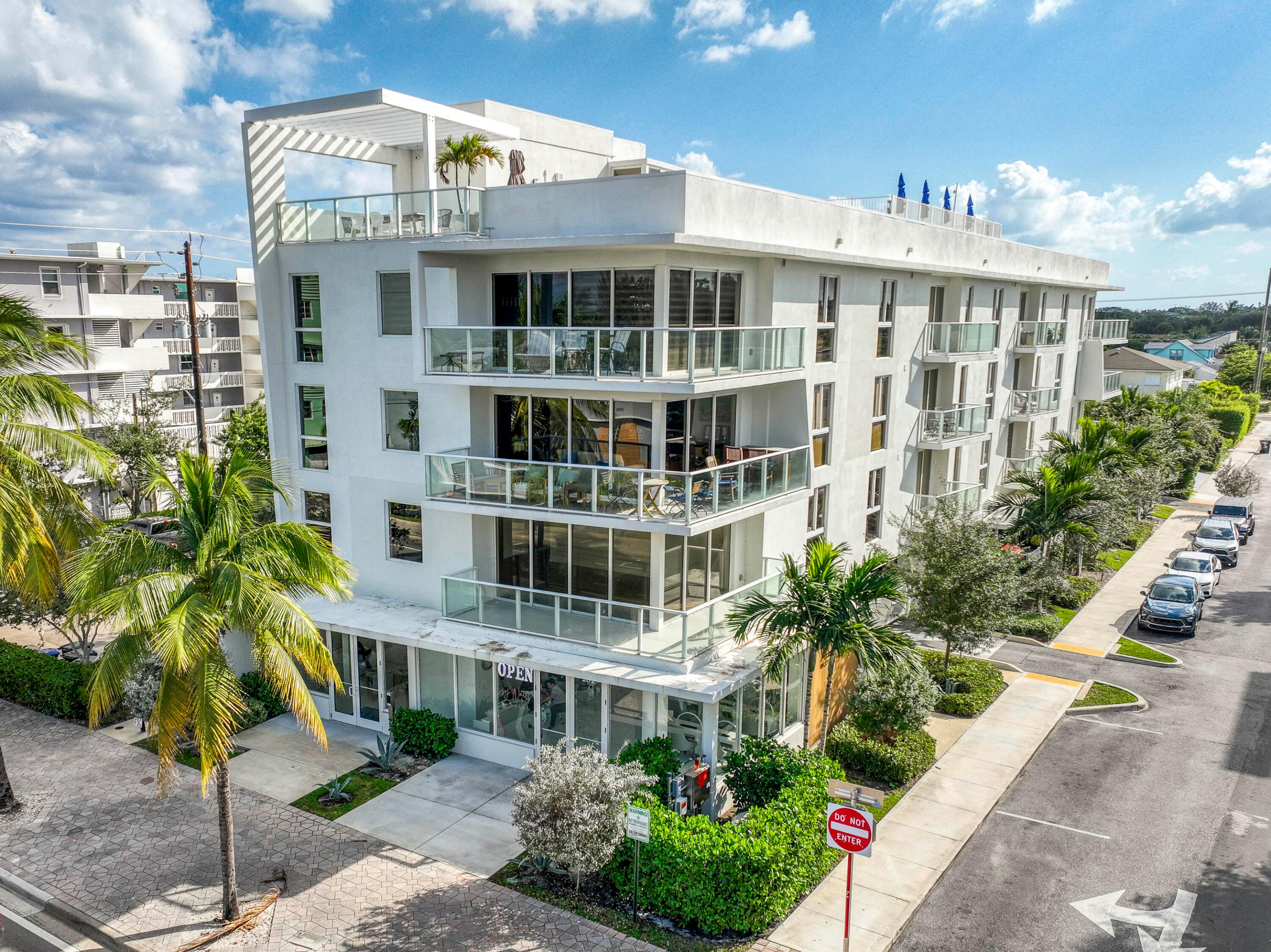 | LUXURY NEW CONSTRUCTION CONDO LESS THAN ONE MILE FROM THE BEACH | Welcome to ALORA Luxury Residences, an exclusive boutique building showcasing just 12 contemporary units in the heart of Lake Worth Beach. This stunning 3-bedroom, 2-bath residence offers the perfect blend of modern design, premium finishes, and unbeatable convenience, located only moments from the beach and steps away from restaurants, golf courses, shops, entertainment, parks and the Intracoastal.
Inside, you'll find a bright, open layout enhanced by floor-to-ceiling impact windows, electric shades, and sleek tile flooring throughout. The spacious living area opens to a wraparound terrace, ideal for enjoying evening breezes or effortless indoor-outdoor entertaining. A built-in wet bar adds an elevated touch for hosting. The chef-inspired kitchen is equipped with Bosch appliances, a wall oven, premium cabinetry, quartz countertops, a large island, and soft-close drawers. A full-size washer and dryer are located inside the unit for added convenience. The building also includes a dedicated lobby area, bike racks, storage and private building-garage.  Head up to the private rooftop, where you can soak in the sunset and Intracoastal views from the sparkling pool. Additional rooftop amenities include a summer kitchen, lounge seating, and plenty of space to relax or entertain.
Experience luxury coastal living in a rare, intimate setting, all within minutes of everything this vibrant beachside community has to offer.