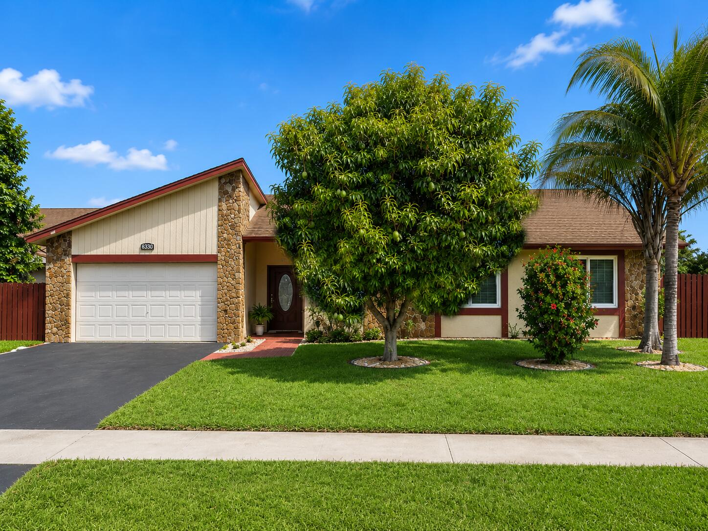 This well-maintained 3-bedroom, 2-bath single-family home in Lauderhill offers key updates, everyday convenience, and strong outdoor appeal. Features include a 2-car garage, updated kitchen, Newer roof (2022), and New impact-rated windows | sliding doors (2019) and Newer A/C (2019) for added comfort and peace of mind. The spacious backyard includes fruit trees, creating a useful outdoor area for relaxing, gardening, or entertaining. Located near Commercial Blvd, the home offers convenient access to shopping, dining, grocery stores, services, local parks, and recreation options. Quick access to the Florida Turnpike and major west Broward corridors makes travel throughout Broward and South Florida easier. FHA and VA financing are welcome.