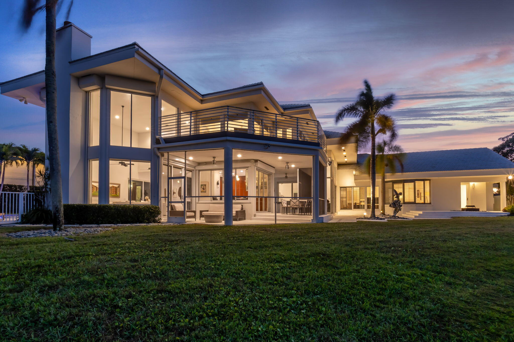This contemporary masterpiece by renowned architect Randall Stofft brings Miami to Boca Raton!  A coveted GOLF MEMBERSHIP to Woodfield Country Club is available - NO WAITING LIST!!  Bright and light this home boasts over 6000 sq ft of zen-like living space with 5BD/6BA featuring volume ceilings and flow through views of the lake.  Enjoy this lake view from most rooms including the master bedroom, the Downsview highly functional and stylish kitchen with top-of-the-line appliances, the wrap around pool deck with heated pool and the 2nd floor Trex deck off a guest suite.  Artwork has a home here as well as there are many creative spaces and walls for display!  All 5 bedrooms are en-suite/possible 6th bedroom currently used as an office. A Must See - live your best Florida lifestyle here! House has a 35 KW generator and is completely covered with impact windows and/or shutters offering safe shelter in a storm.  Central location close to A rated Boca Raton school district and private schools, parks, Town Center Mall, restaurants and I-95 and the turnpike.  The oversized lot offers privacy and great outdoor space for entertaining and living your best Florida lifestyle!