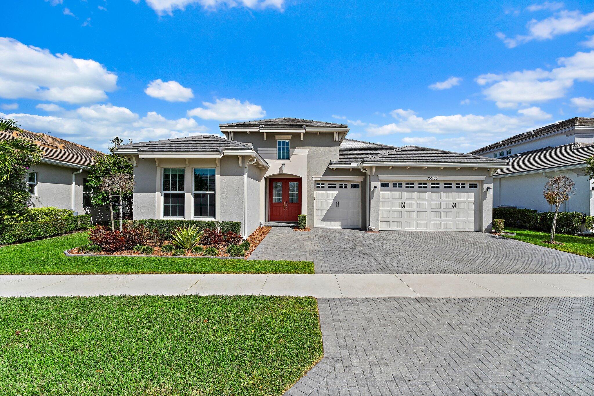 Rarely available Sanderling model located in the highly sought-after community of Westlake, Palm Beach County's newest city. This spacious residence offers a 3-way split floor plan with 4 bedrooms plus an office/den, 4 full bathrooms, and a 3-car garage, providing both comfort and functionality. Newer construction built in 2020, this home features impact windows and doors throughout, hard wired for security system, both offering peace of mind and energy efficiency. The garage is upgraded with epoxy flooring and custom wall built-ins, ideal for organization and storage. This premium lot provides a fully fenced in oversized backyard with private preserve and water views, perfect for relaxing and entertaining with an extended and screened in back patio.  Ideally located with convenient access to major highways, top-rated schools, shopping, dining, and beaches.