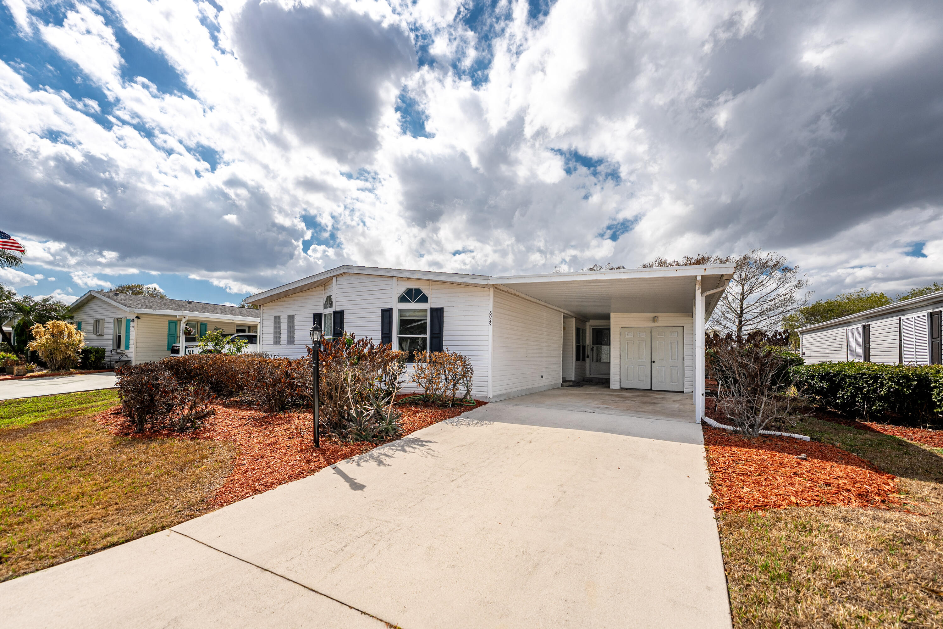 Rare find ... THREE bedrooms and two bathrooms. Almost 2100sf of living space. Plenty of room for family and friends. Huge Kitchen.  NEW ROOF 2025; NEW Flooring; Two beautiful NEW glass doors to welcome your guests; New interior paint throughout.  Enjoy sitting on your back lanai watching golfers tee off for a full game of golf. Fantastic location. Plenty of storage. This home is move in ready!  Don't miss your opportunity to own a slice of Florida in the highly desired Savanna Club. Experience the best of 55+ living with resort style amenities featuring staffed clubhouses, fitness center, 3 swimming pools, tennis, pickle ball, 10,000sf theater, 18 hole golf course, restaurant, etc. Take time to relax or stay busy with the community social calendar. Call today!