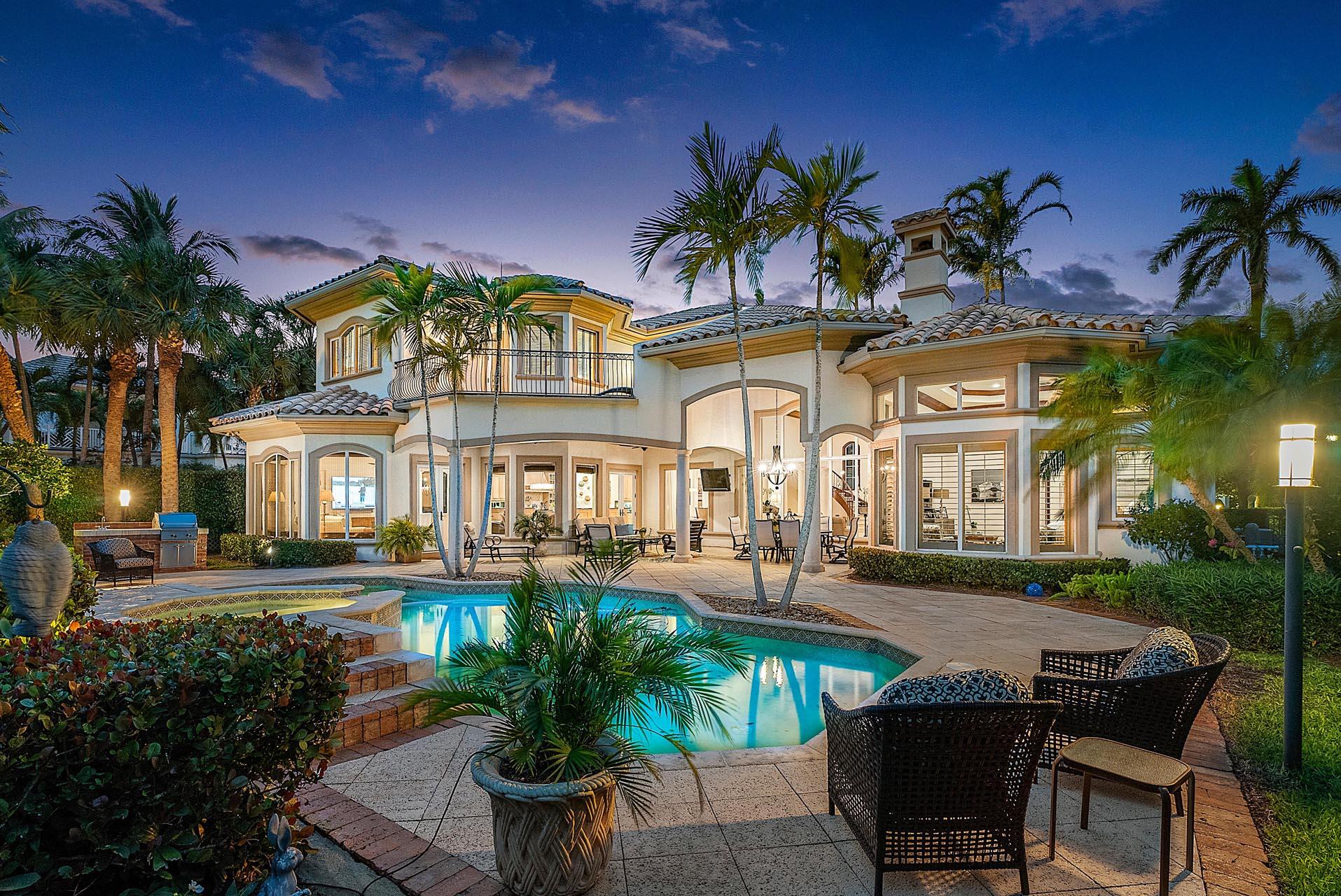 Exquisite and unparalleled, this remarkable estate offers a rare opportunity to live lavishly on 4 pristine fairways of the Signature Jack Nicklaus Signature golf course. Nestled within the prestigious Royal Palm Yacht & Country Club Community, this stunning property boasts a south-facing exposure, affording abundant natural light throughout. Meticulously maintained and appointed to perfection, the home features an open split floor plan, 5 palatial bedrooms, and a handsome office for the most discerning executives. In addition, a tropical oasis backyard escape awaits, complete with a covered patio and oversized heated pool/spa, offering the ultimate retreat from everyday life. The interior of this luxurious sanctuary is a true work of art, with marble floors, volume ceilings, stone columns and custom craftsman details. The owners' retreat encompasses the east wing of the first floor, boasting a bright sitting area, exercise room, His & Her spa-like bathrooms, and walk-in closets. From almost every room, breathtaking panoramic golf course views surround you, and can be enjoyed further on the large balcony off the second-floor VIP suite. Experience the epitome of exclusivity and luxury with this immaculate property, perfectly situated in one of the most coveted communities in the world.