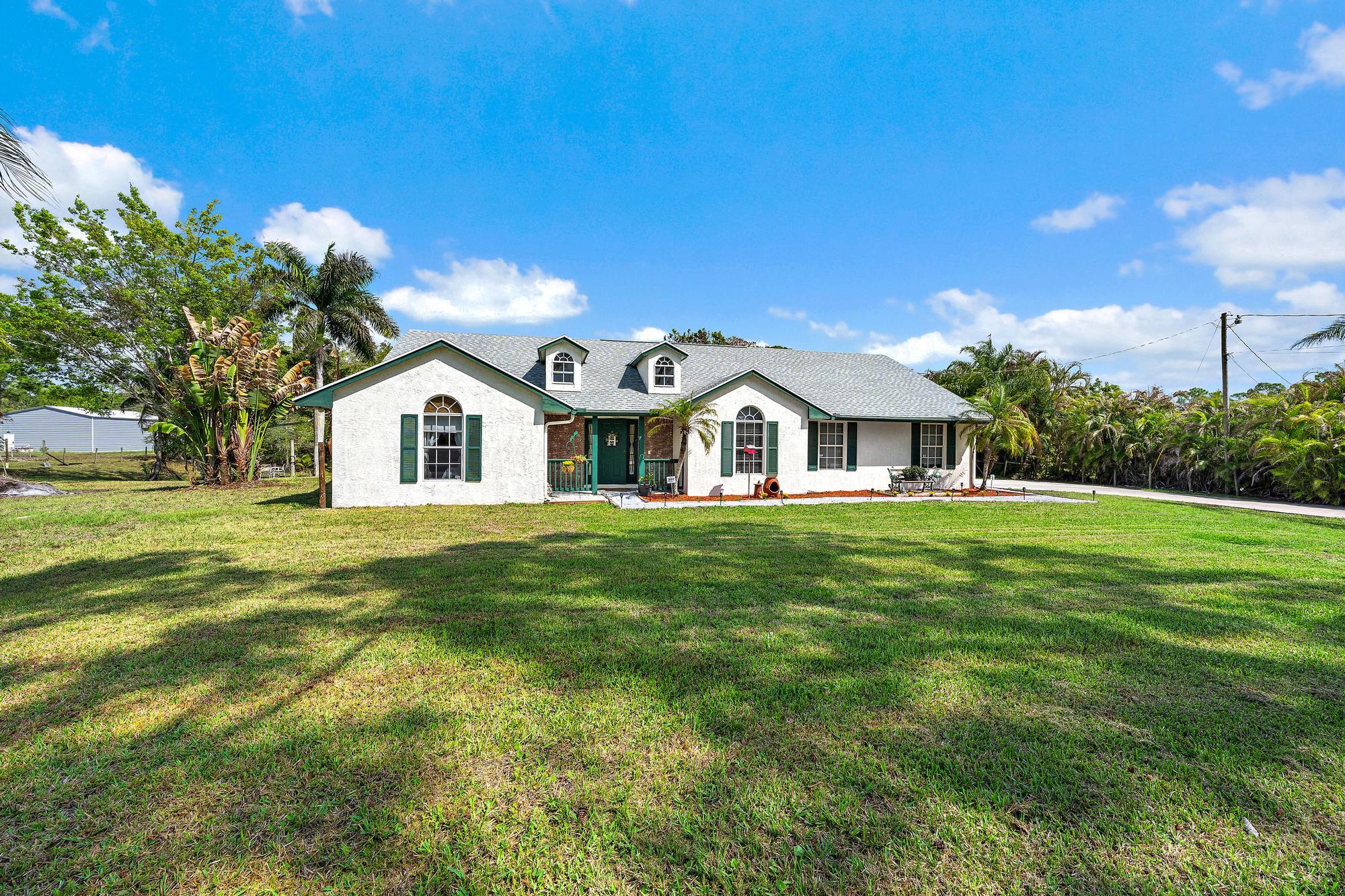 Welcome to the perfect mix of peaceful country living and modern convenience. Set on 1.31 spacious acres, this serene retreat offers ultimate privacy while staying close to shopping, dining, and major roads. Enjoy total peace of mind with a new 2023 roof, a new water heater, and a newer AC. Inside, you'll find a stylishly updated kitchen and remodeled bathrooms. Tech-ready with fiber-optic internet and located near A-rated schools, this home delivers long-term value. Relax by the private pond and deck, or use the ample concrete parking for your toys. With room for a pool, extra building, or a massive patio among mature trees, the potential is endless. Experience modern updates on over an acre of quiet country bliss!