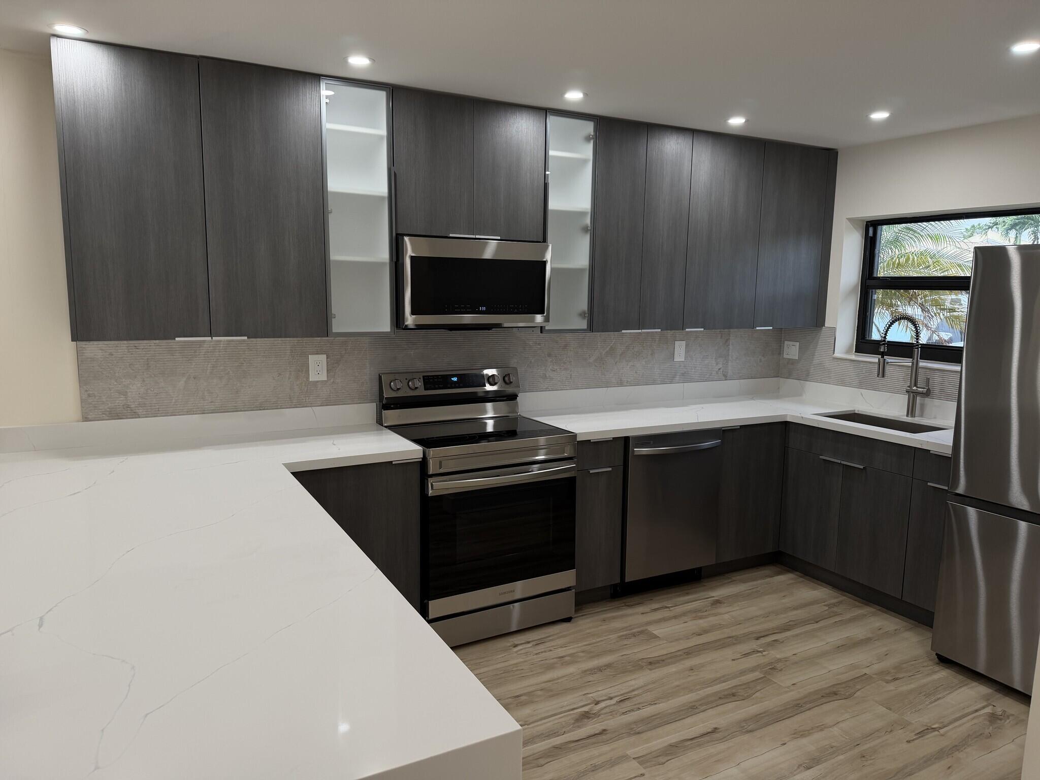 Discover this stunning townhouse nestled in a highly sought-after Margate community, with lake views from the main living areas. The open-concept kitchen features sleek stainless-steel appliances and generous countertop space, flowing seamlessly into a bright living and dining area perfect for entertaining guests. Elegantly remodeled bathrooms feature contemporary colors and finishes, elevating the home's sophistication. The home includes two designated parking spaces and lush outdoor areas for relaxing and enjoying serene water views. With convenient access to parks, shops, and top schools, this home is an ideal retreat for a relaxed, comfortable lifestyle. Woodlake Isles HOA completed new roofs and new parking lot asphalt in the 1st quarter of 2026!
