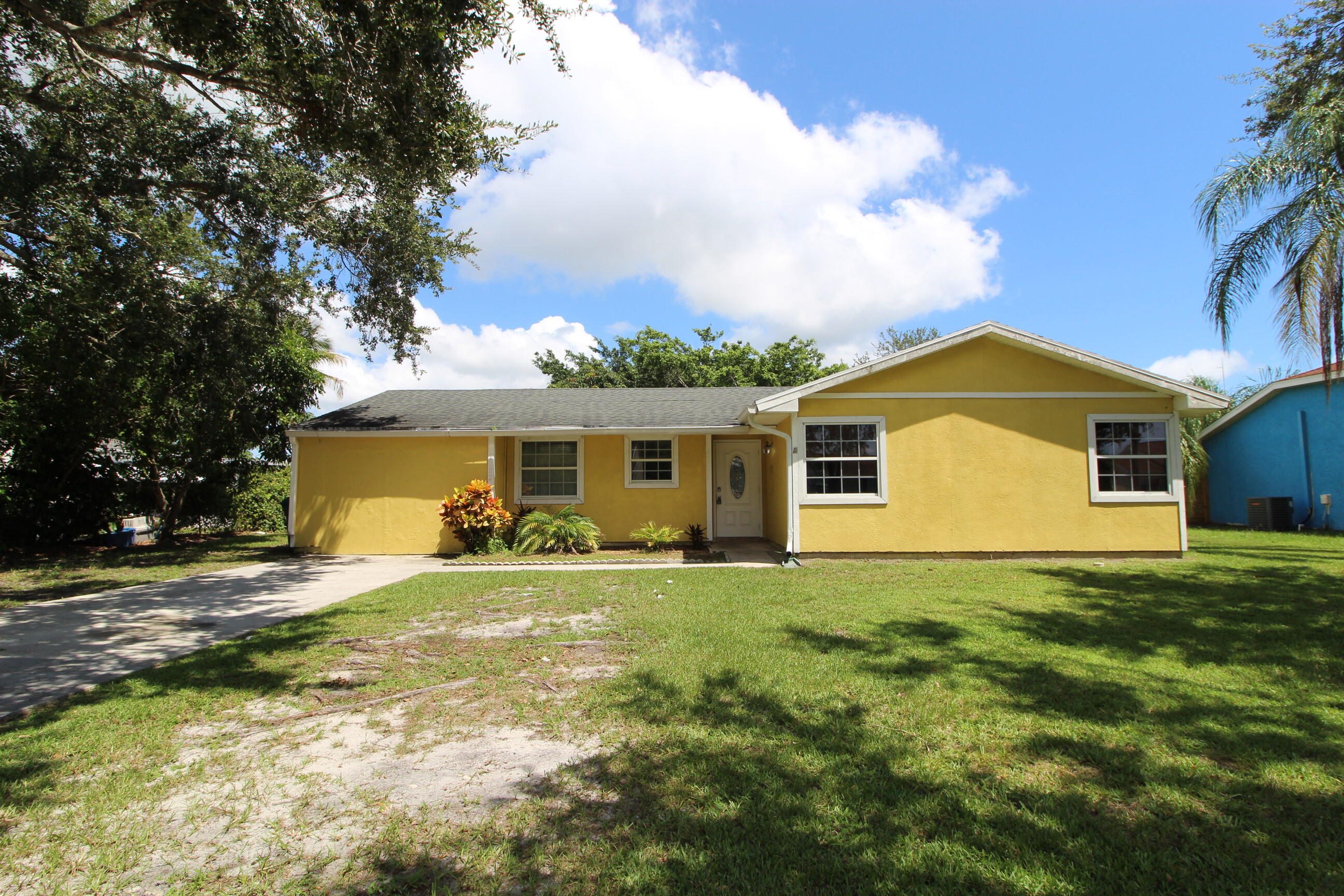 Charming 3-bedroom, 2-bath home with converted garage for extra living space in the heart of Port St. Lucie! Just steps from the Port St. Lucie high school and minutes to shopping, dining, the hospital, and stunning beaches. This charming home offers tile flooring throughout, a functional kitchen, and a smart, split-bedroom layout. With no HOA and a handy storage shed out back, this move-in-ready home is packed with value. Perfect for first-time buyers, downsizers, or investors!