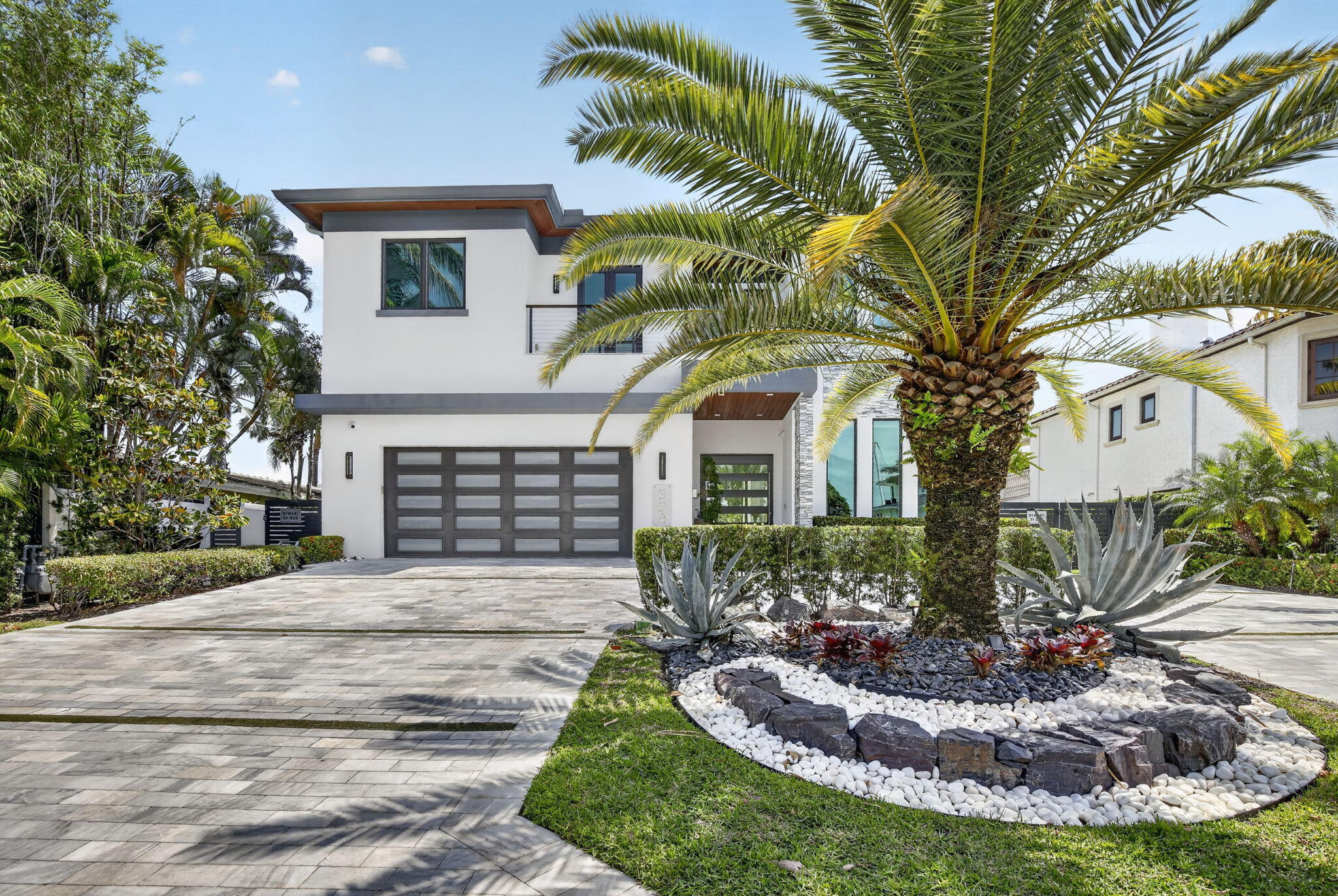 Experience refined waterfront living in this stunning Ocean Access 2021 estate located in the prestigious Las Olas Isles. 4 spacious bedrooms and 3 beautifully appointed bathrooms, designed with both comfort and elegance in mind. Boasting 80 feet of prime waterfront, the property is a boater's dream, complete with a 20,000-pound boat lift for effortless access to the water. The east-facing backyard captures serene views and gorgeous morning sunlight, creating a peaceful outdoor retreat. Enjoy the  amenities including an inviting pool accented by gas fire pit and bowls,  relaxing jacuzzi, and a outdoor entertaining grill area. The expansive gazebo provides the perfect setting for entertaining or unwinding in style. The layout is filled with natural light.  Chef's kitchen, Wolf appliances.
