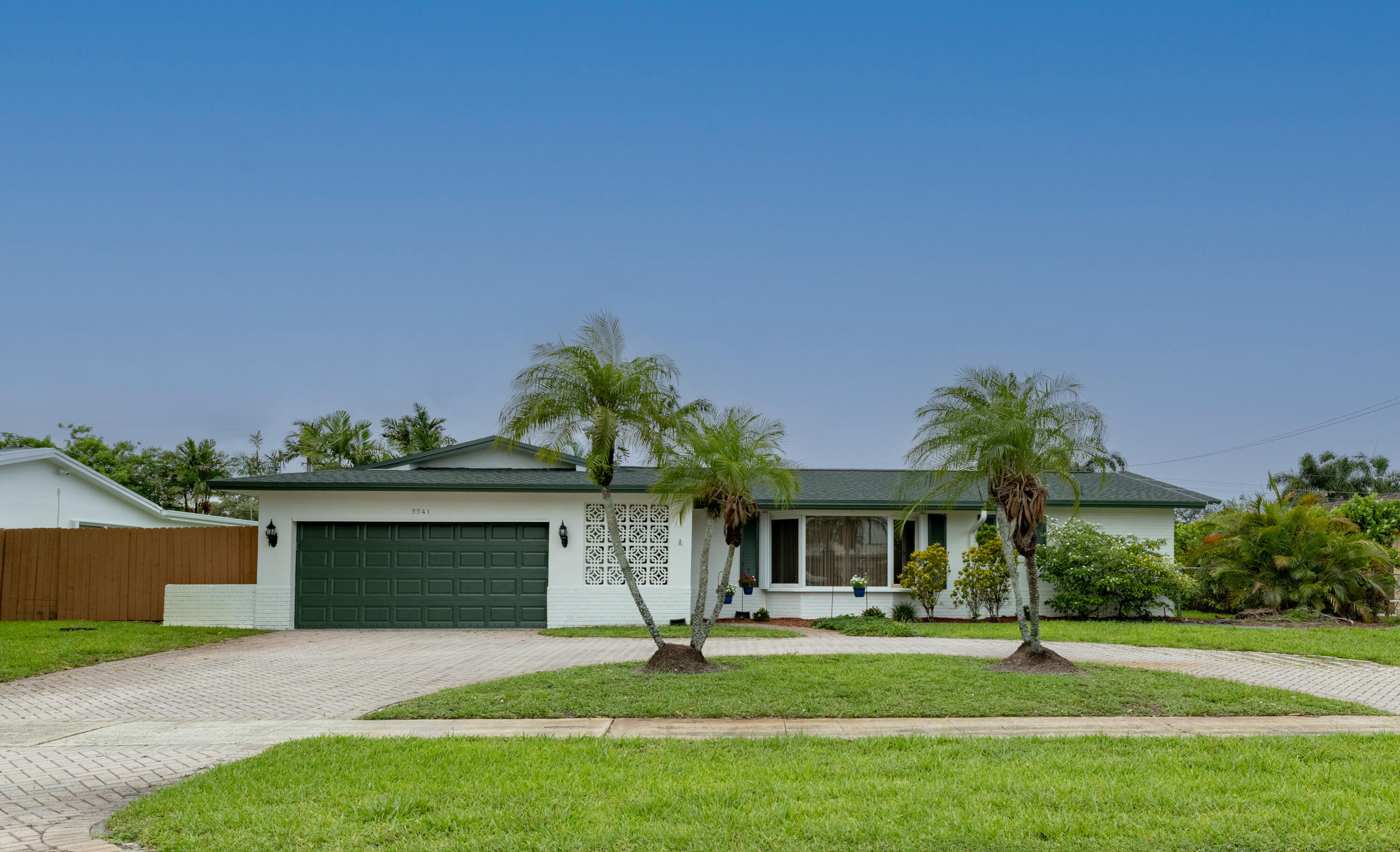 Plantation Park Pool Home! 4 Bedrooms | 2 Baths | 2 Car Garage | New Roof | New AC | Split Floor Plan | Circular Driveway | No HOA.  Welcome to this spacious 4-bedroom 2-bathroom pool home in the highly desirable Planhtation Park Neighborhood.  Offering 2,479 square feet of air-conditioned living space and 2,807 total square feet.  This residence combines comfort, functionality, and exceptional value in one of Plantation's most established communities.  Designed with a desirable split-bedroom floor plan, the home features expansive living areas, a formal dining room, and a generous family room, providing the ideal layout for both everyday living and entertaining.   Step outside to your private backyard oasis complete with a sparkling pool and ample space for relaxing and entertaining.  Walk through side entrance of Heritage Park during the week.