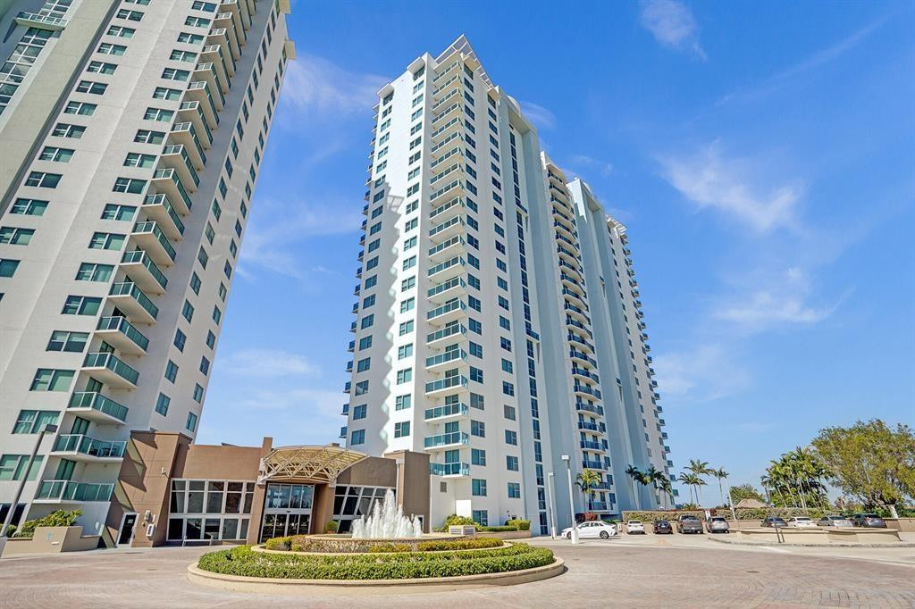 BREATHTAKING SUNSET LAKE VIEWS &  RESORT-STYLE LIVING, ideally located across from Sawgrass Mills Mall and stadium, with fine dining and shopping within walking distance. SPACIOUS 1-BEDROOM + CONVERTIBLE BEDROOM, 2-BATHROOM unit features an open layout, in-unit WASHER and DRYER, and a versatile floor plan ideal for personal use or rental opportunities. Residents enjoy a FIVE-STAR LIFESTYLE with AMENITIES including a BUSINESS CENTER, FITNESS CENTER, POOL, CONFERENCE ROOM, SAUNA, SPORTS LOUNGE, SOCIAL HALL hall, TENNIS COURT, and PLAYGROUND. MULTIPLE LOUNGE areas create a true resort atmosphere. Unit overlooks the lake and pool deck, offering tranquil views and natural light. Perfect for corporate clients, families, or a vacation home. Building offers 24-HOUR SECURITY COVERED GARAGE PARKING
