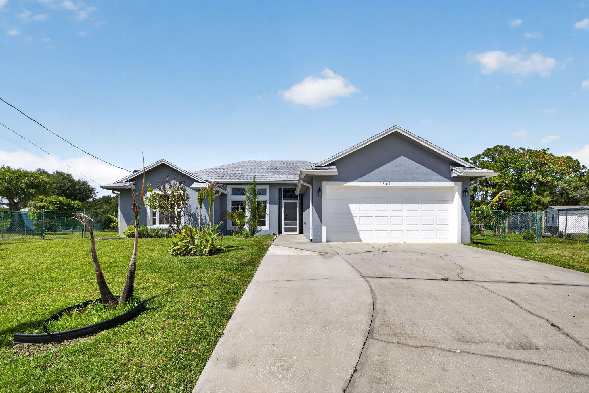 Nestled in Port Saint Lucie, this 3BR/2BA home blends comfort, convenience, and major value. Peace of mind offered by the 2020 roof and the spacious 2-car garage. Spacious lot at just under 1/3 acre. Centrally located with quick access to the best of the Treasure Coast's beaches, golf courses, and schools.