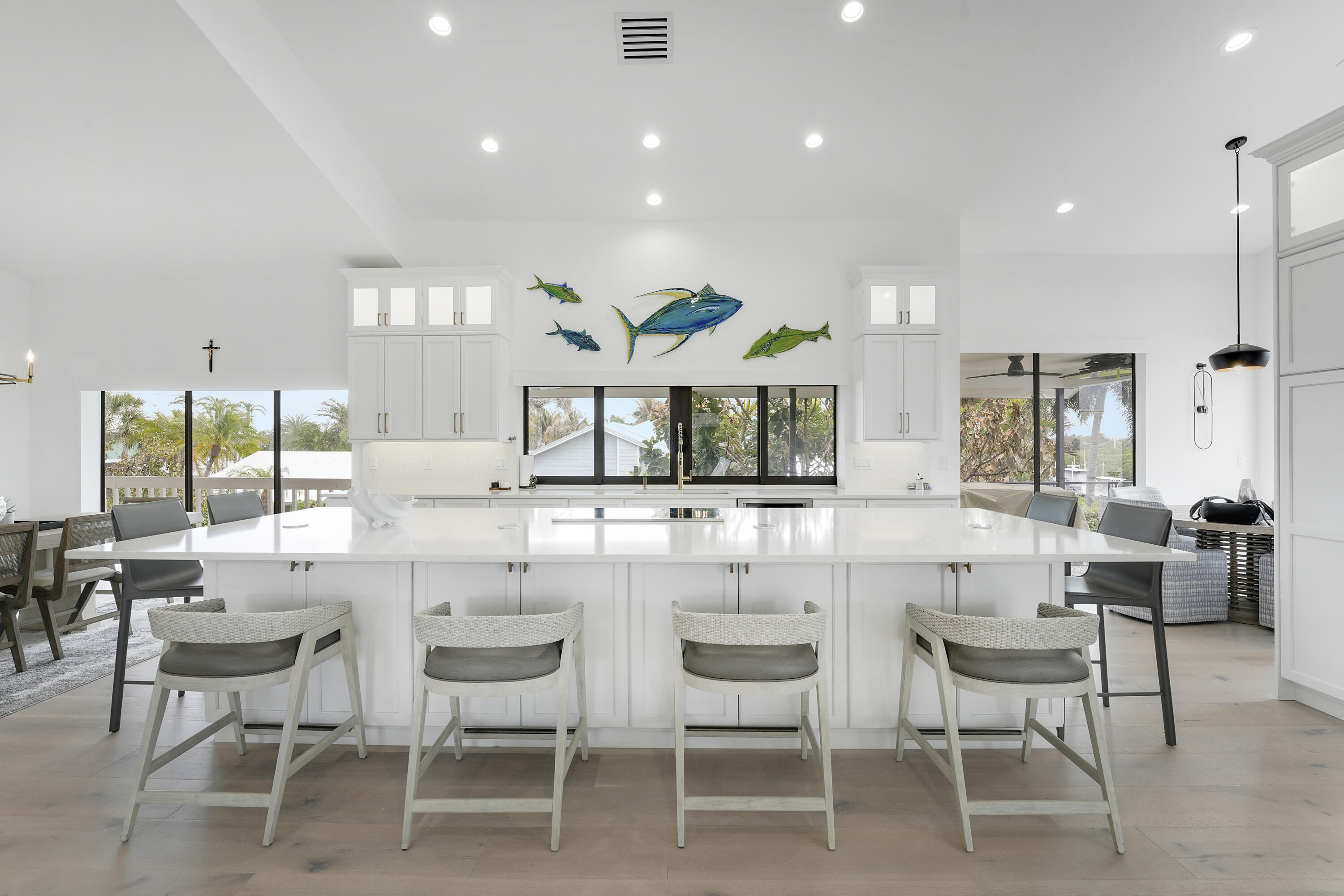 Welcome to the exclusive gated community of Mariner Cay! This Coastal-Modern waterfront home features a spacious 5-bedroom, 4.5-bathroom layout, offering a perfect blend of luxury and comfort across 3,960 living square feet.  Set on a near .5-acre corner lot, this Newly Renovated residence showcases a modern coastal aesthetic with an open floor plan that seamlessly integrates indoor and outdoor living. Enjoy the ease of a split floor plan, providing privacy and space for family and guests.  Equipped with a private dock and TWO boat lifts, this home is perfect for boating enthusiasts. Only minutes from Stuart's finest waterfront restaurants, the intracoastal, and offshore fishing. This location is unmatched!  Schedule your private tour today!