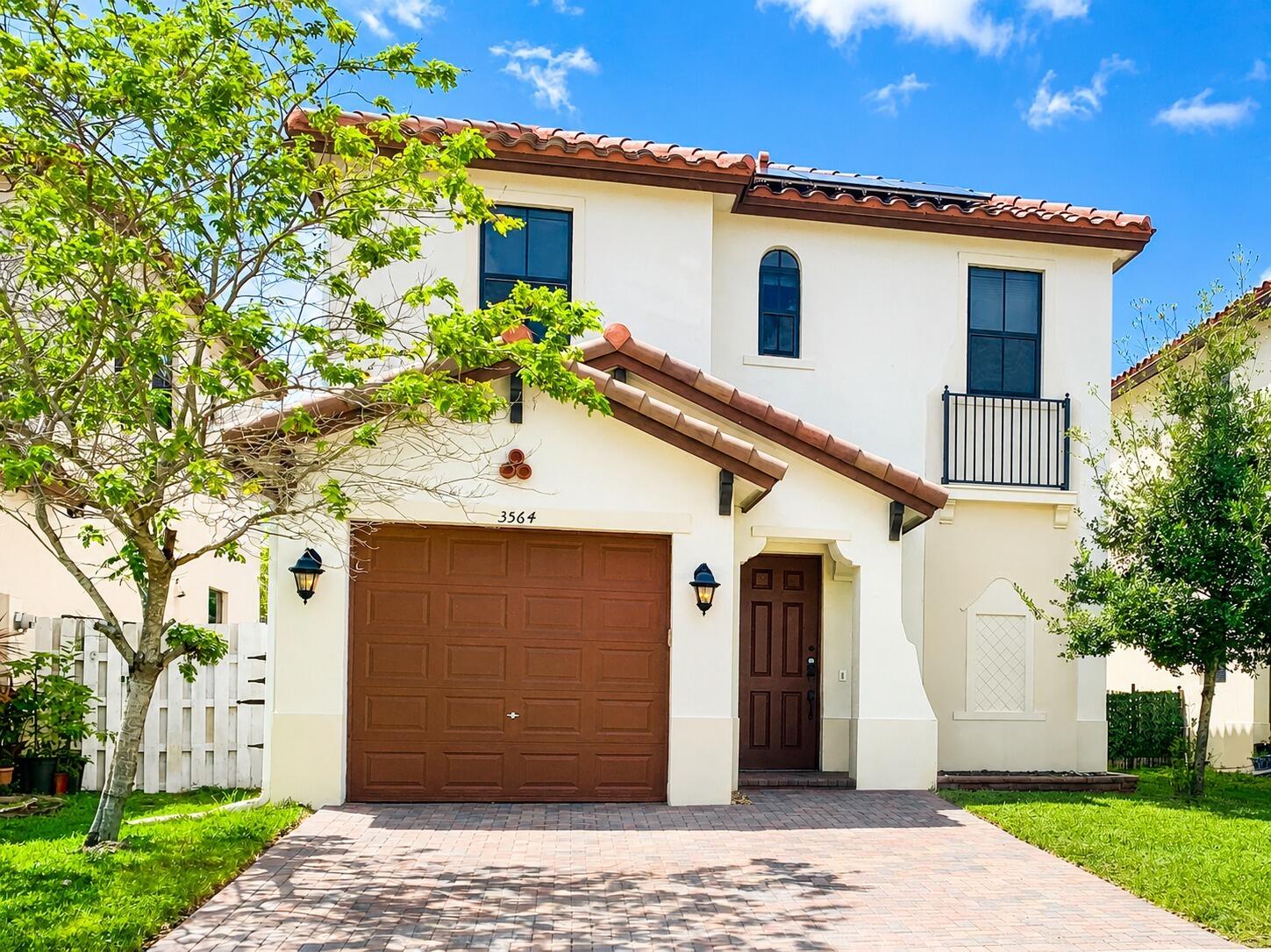 Beautifully upgraded 3-bedroom, 2.5-bath home located in a gated community with convenient digital HOA access and zoned for highly rated Sea Castle Elementary School. This move-in-ready property features soaring 10-foot ceilings and a stunning designer kitchen complete with quartz countertops, stainless steel appliances, and a butler-style pantry. Enjoy peace of mind with hurricane-impact windows and doors, plantation shutters throughout, updated bathrooms, a customized primary closet, and a brand-new A/C system installed in 2024. The home also includes transferable solar panels for added energy efficiency, with a fixed solar payment of approximately $100/month for 25 years and average electric costs around $106/month. In the last 30 days, the solar panels produced 1264 kWh.Tesla charger. Transferable Solar Panels with SUNRUN (check website: . sunrun ), paying $103 a month with the last FPL bill at $106 The last 30 days the solar panels produced 1264 kWh