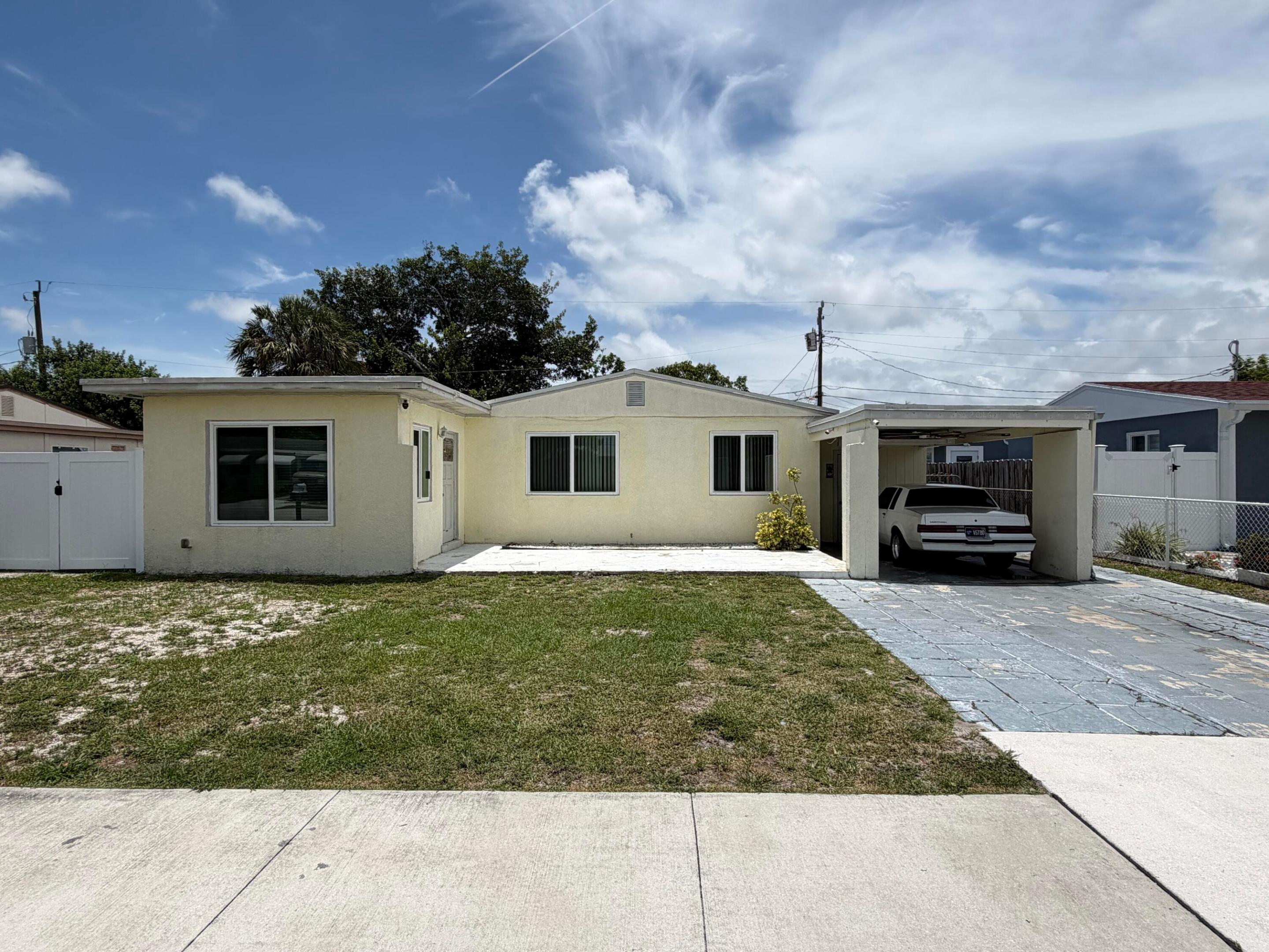 Centrally located in the heart of West Palm Beach, this 3-bedroom, 2-bathroom rental offers convenience, comfort, and plenty of outdoor space! Enjoy easy access to downtown West Palm Beach, Palm Beach International Airport, beautiful local beaches, shopping, dining, and entertainment.  This pet-friendly home features a spacious fenced backyard perfect for relaxing, entertaining, or letting pets play freely. The covered carport and extended driveway provide plenty of parking for multiple vehicles. With no HOA restrictions, you'll enjoy added flexibility and convenience.  A fantastic opportunity to enjoy the South Florida lifestyle in a prime West Palm Beach location!