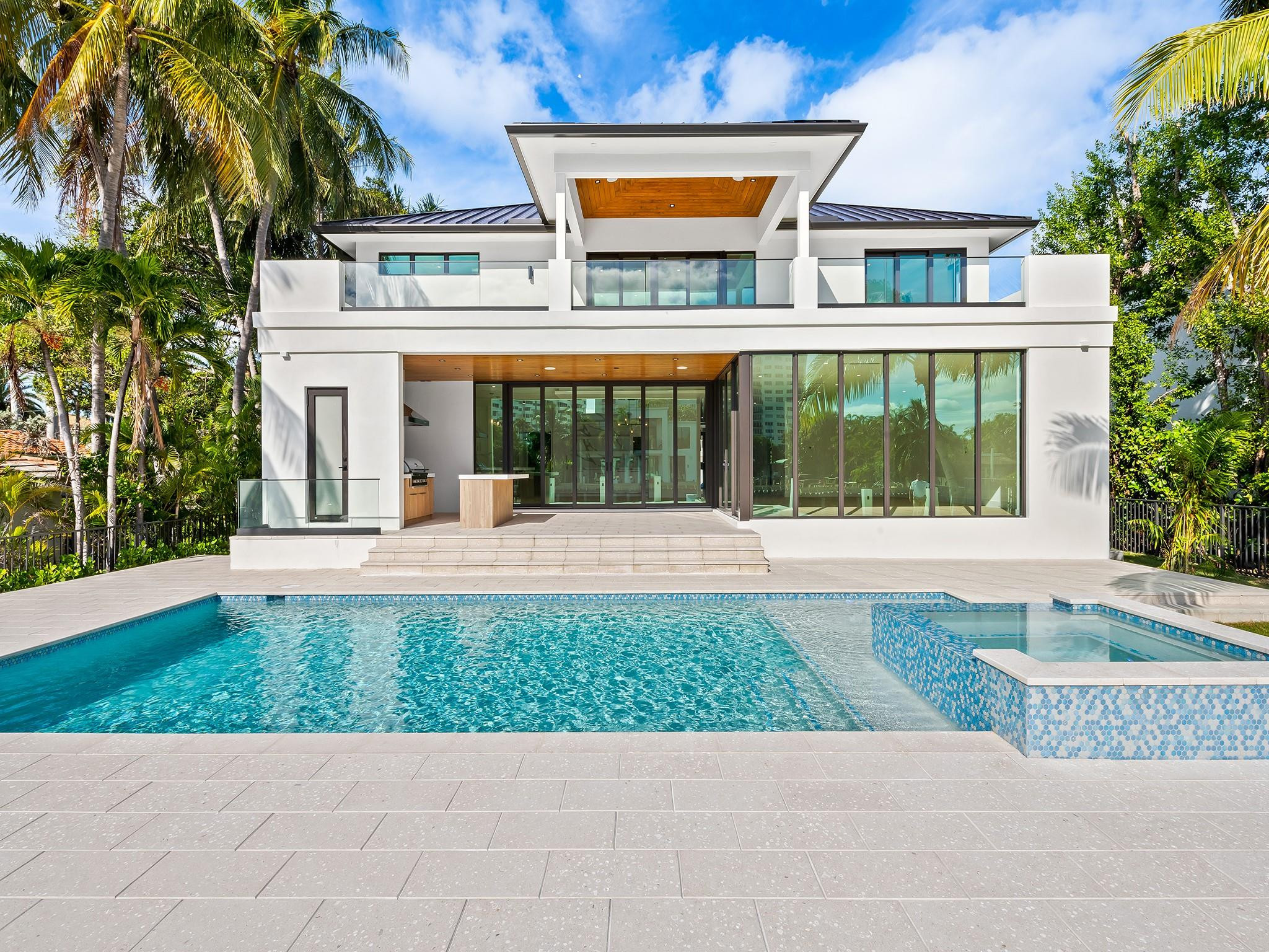 Another incredible waterfront home built by Dotoli Development, this exceptional 5-bedroom, 7-bathroom residence is located in Fort Lauderdale’s prestigious Seven Isles. Features include a wood floor throughout, designer bathrooms, a gourmet Sub-Zero/Wolf kitchen, Lutron lighting and shades with Control4 automation, and an elevator. Enjoy a covered patio, summer kitchen, saltwater pool with spa, and a 75’ dock with direct ocean access. With a 3-car garage and proximity to Las Olas, dining, shopping, and beaches, this home delivers true luxury waterfront living.