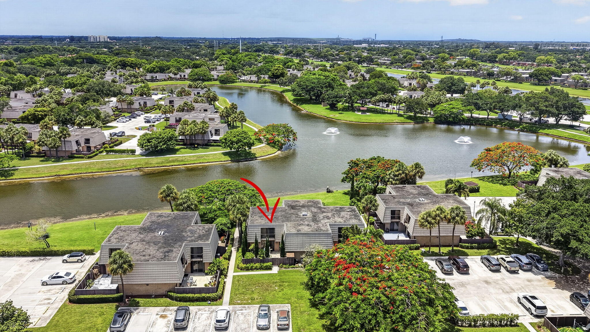 Affordable Move- In Ready Townhome in desirable Sandalwood Lakes South. Feel the tranquil vibes of this walkable community surrounded by lakes and greenery. This 2 Bed, 2.5 Bath CBS unit has an oversized Living Room and Dining area open to the Kitchen. Downstairs is great for entertaining with the kitchen and living room sliders open to the large fenced concrete patio great for BBQ and the happy healthy plants are included! Laundry in the downstairs bath. Upstairs each bedrom has private full bathrooms and a balconies overlooking the patio.  The community offers three pools with clubhouses, walking trails, picnic areas, playgrounds, and sports courts. Centrally located near I-95, downtown West Palm Beach, The Square, Tanger Outlets, and PBI Airport.