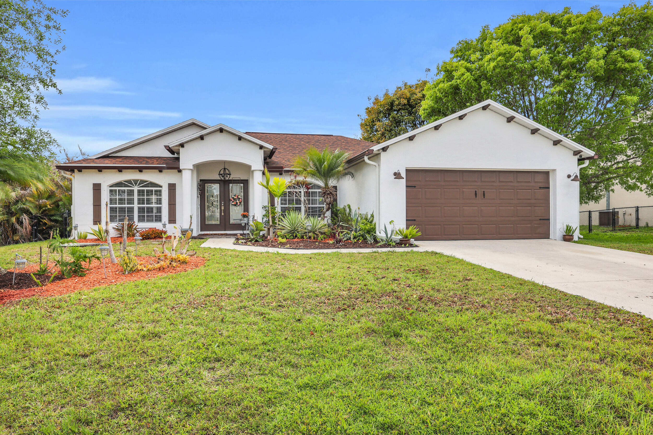 Beautifully maintained 4-bedroom, 3 full bath rental home with a heated saltwater pool, offering comfort, space, and easy South Florida living. This light-filled home features tile and wood flooring throughout, a formal dining room, and a charming breakfast nook with panoramic views of the pool.  The kitchen offers granite countertops, ample cabinetry, and a functional layout ideal for everyday living and entertaining. Step outside to a private backyard oasis with lush landscaping, mature trees, and an extended patio — perfect for relaxing or enjoying the Florida lifestyle.  Located in a non-HOA community close to Tradition, shopping, dining, schools, and major roadways.
