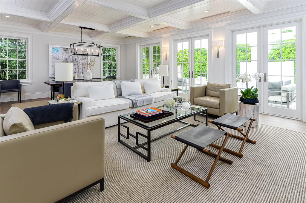 Built in 2017, this beautiful Island-inspired 4BR/4.1BA is open and inviting. Fantastic In-Town location on the Lake Block of Australian Avenue. Light and bright formal living room with stunning coffered ceiling opens to pergola-covered loggia with built-in grill. Gourmet chef's eat-in kitchen with top-of-the-line appliances and finishes. Large master suite with dual baths and walk-in closets and balcony overlooking the pool. Additional highlights include wet bar, elevator, garage, and gorgeous hardwood flooring and details throughout.