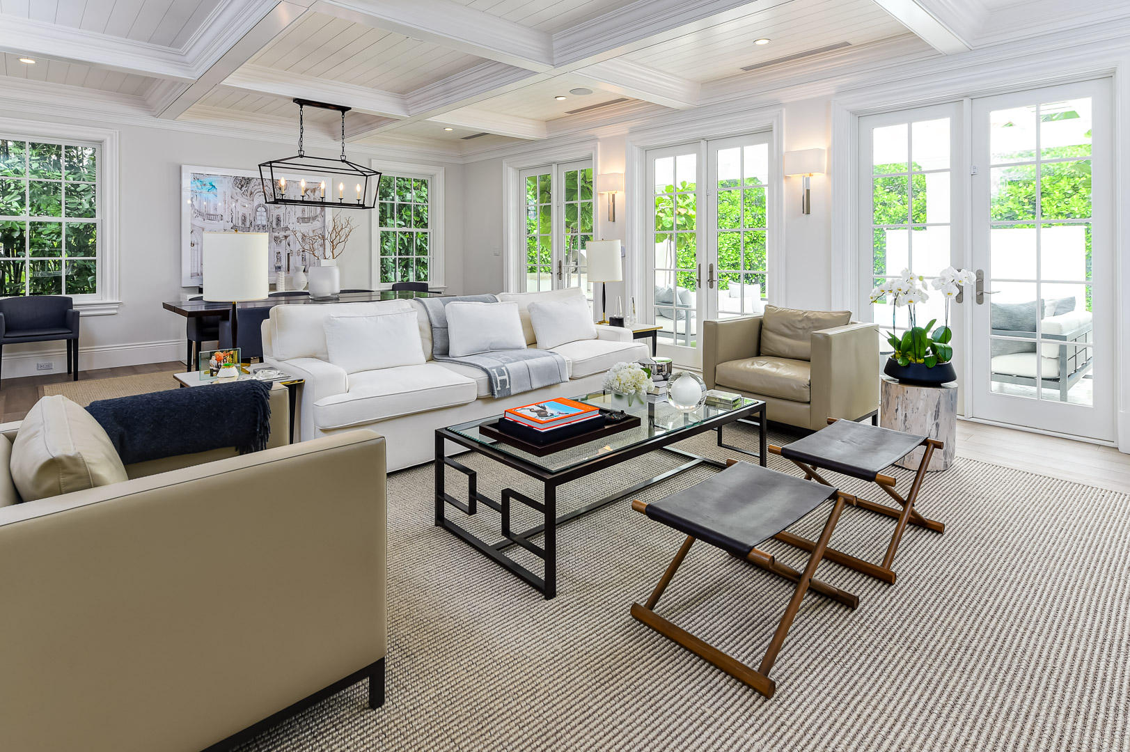 Built in 2017, this beautiful Island-inspired 4BR/4.1BA is open and inviting. Fantastic In-Town location on the Lake Block of Australian Avenue. Light and bright formal living room with stunning coffered ceiling opens to pergola-covered loggia with built-in grill. Gourmet chef's eat-in kitchen with top-of-the-line appliances and finishes. Large master suite with dual baths and walk-in closets and balcony overlooking the pool. Additional highlights include wet bar, elevator, garage, and gorgeous hardwood flooring and details throughout.