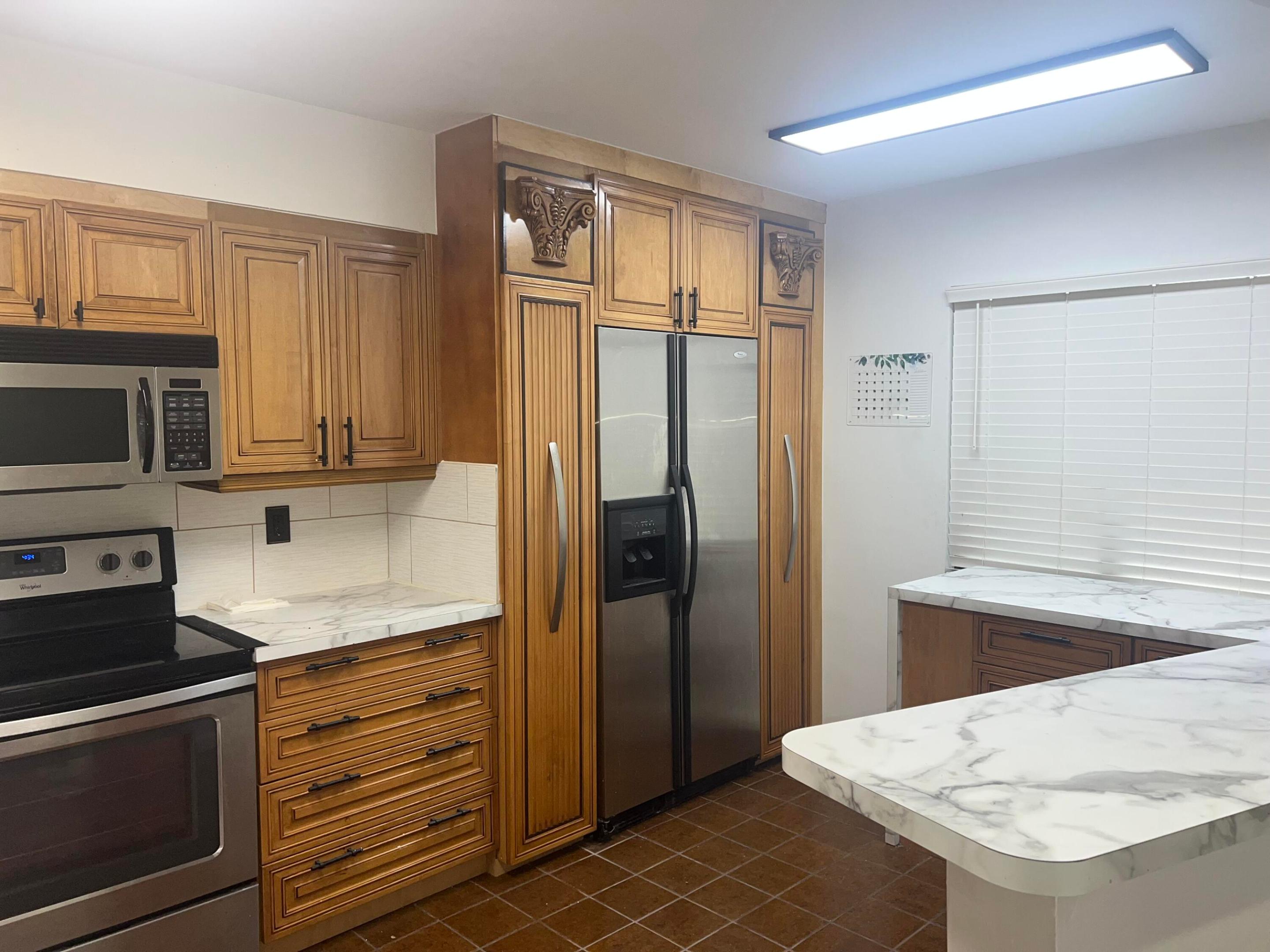 Lowest priced 2/2 condo in the building that you can make your own with over 1220 sq ft of blank canvas. This is a corner unit offering privacy, along with additional windows, making it feel like a single family home! Stainless steel appliances & tile/laminate flooring throughout. Master has 2 walk-in closets. Cypress Bend has several amenities reflecting a country club-like atmosphere, including, but not limited to tennis, basketball, fitness center, playground, bike/walking paths & pickleball, just to name a few. Access to 3 18-hole championship golf courses right across the street, as well as the nearby Harrah's Casino with entertainment & award-winning restaurants. Minutes to I-95, the turnpike & beaches. Seller with pay buyer's first 12 months of HOA fees with a full-price offer.