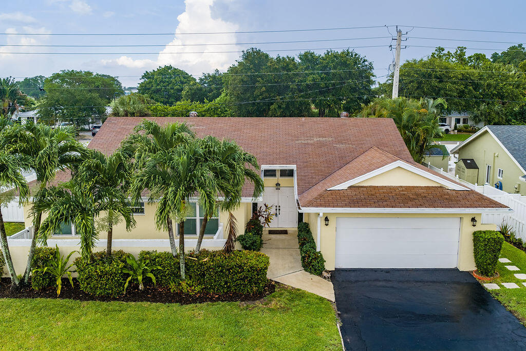 Welcome to this charming single-story home in Homewood Lakes, Delray Beach, designed for comfortable living & entertaining. The spacious primary suite features a large walk-in closet, double vanity, & a bidet toilet with a warming seat. The Jack-&-Jill bathroom includes a bathtub, ideal for families with young children. Additional highlights include a refrigerator with a water dispenser, a pet door leading to the garage, & a washer & dryer conveniently located in the two-car garage. Situated in the established Homewood Lakes community, this well-maintained home offers practical amenities, functional living space, & a desirable Delray Beach location. Appliances approx 10 yr old, Air handler 4 yrs old & water heater 5-6 years old. All impact windows except slider in primary. Will not last!