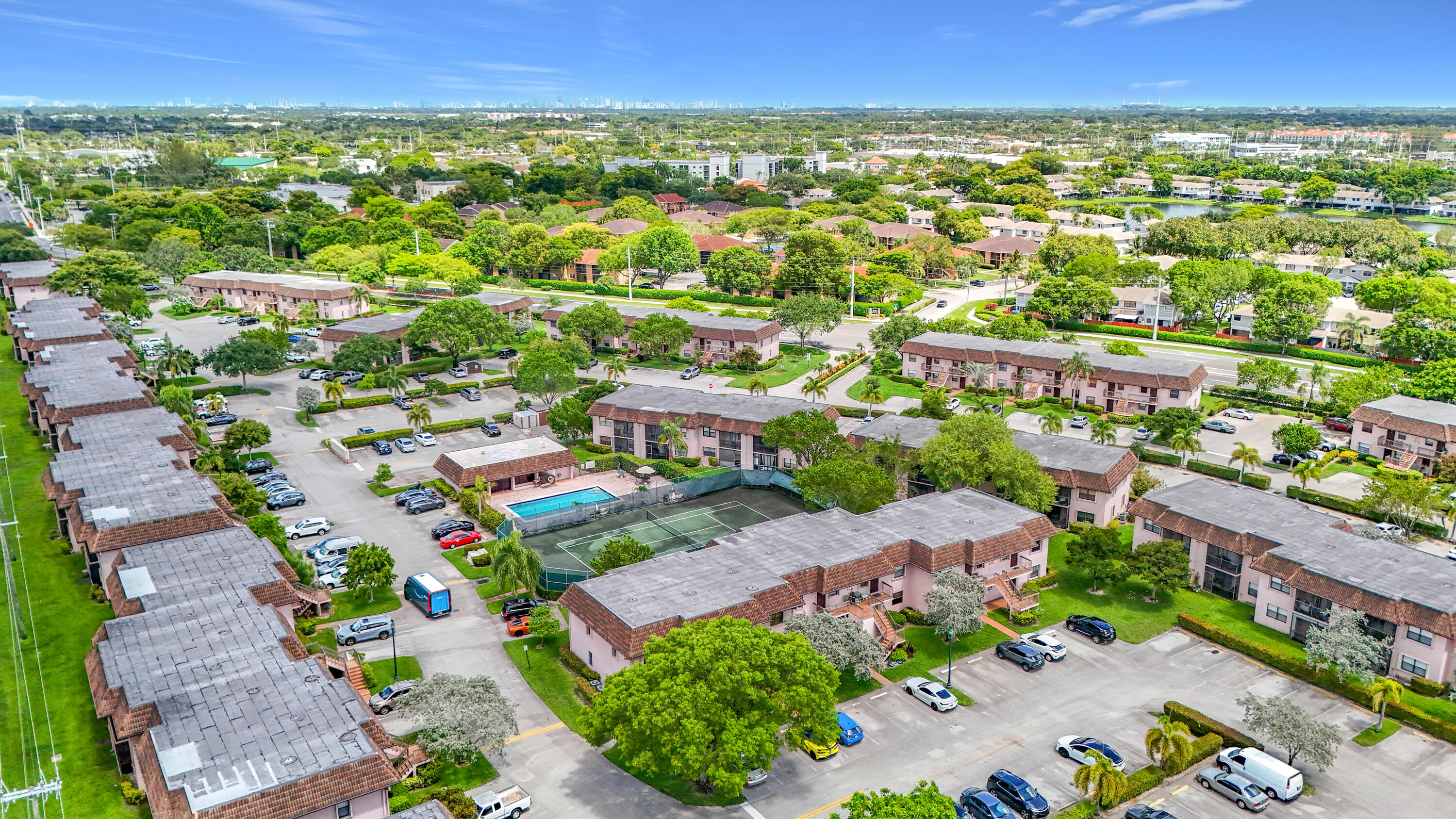 Beautiful first-floor condo located in the heart of Pembroke Pines within a well-maintained community offering resort-style amenities including a pool, tennis courts, and lush green spaces. This bright and spacious unit features an open living and dining area with wood-look flooring, a functional kitchen with ample cabinetry, and a screened patio overlooking landscaped grounds. The generously sized bedroom offers plenty of natural light and storage. Washer and dryer conveniently located in unit. Easy access to shopping, dining, parks, and major highways. Enjoy low-maintenance South Florida living in a prime central location.