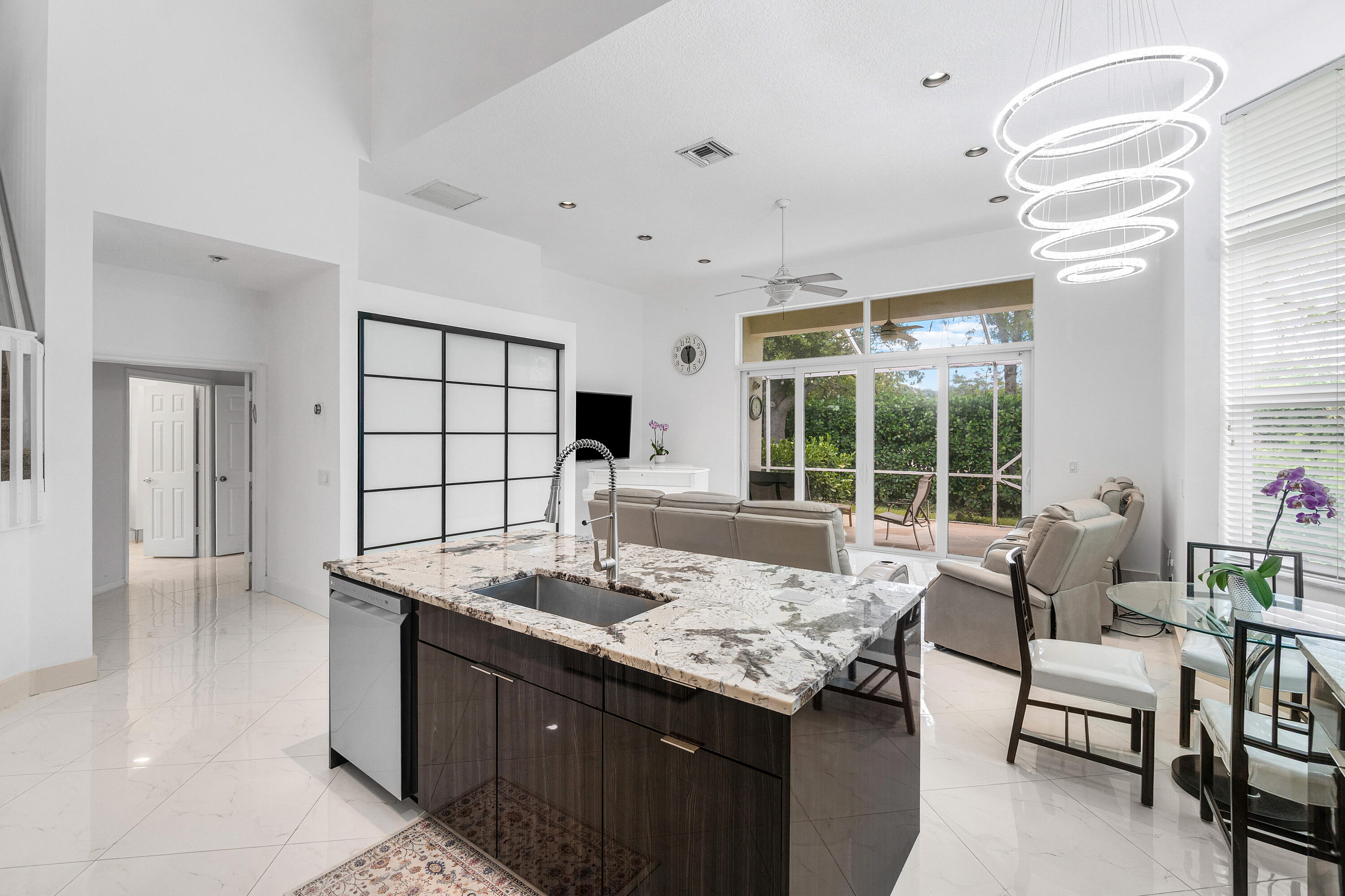 Walking distance to parks, tennis facilities, schools, community amenities, and nearby HOUSES OF WORSHIP! IMPACT windows , Brand new ROOF, New Floors. This Beautiful 5-bedroom, 4-bath, Fully Remodeled two-story home located on a tranquil cul-de-sac in the desirable Cypress Cay community. Light and bright with soaring ceilings, spacious formal living and dining areas, and an expansive kitchen and family room overlooking a huge domed screened patio ideal for indoor/outdoor living and entertaining. The downstairs primary suite features renovated finishes and custom built-ins for additional storage and functionality.  Upstairs offers one bedroom with ensuite bath, two additional generously sized bedrooms connected by a Jack-and-Jill bathroom, plus a versatile loft perfect for an office, media room, reading area, or flex space. Residents of Cypress Cay enjoy access to a community pool, spa, and tennis court, all within a smaller, well-located subdivision in the Parkland school zone.