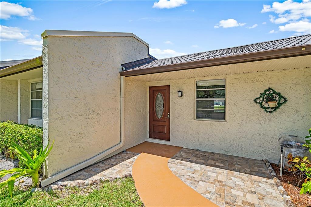 This gorgeous completely renovated 2/2 villa is move-in ready and overlooks the lake! Everything was recently updated and painted, no popcorn ceiling here! Kitchen features beautiful white cabinets & granite countertops, brand-new stainless steel appliances and LED lights. Both bathrooms completely redone! Tile floors throughout while primary bedroom has lovely views of the lake. Enjoy a nice evening on the enclosed patio. Washer & dryer inside unit. A/C 2014, WH 2018. Fabulous clubhouse, workout facilities, large pool, spa, tennis and shuffleboard and so much more for active seniors. Bus service to shopping & medical plazas. One person must be 55+. This phase B allows 1 pet per unit under 30 pounds. Basic cable & water included in the monthly dues. One year of ownership prior to renting.