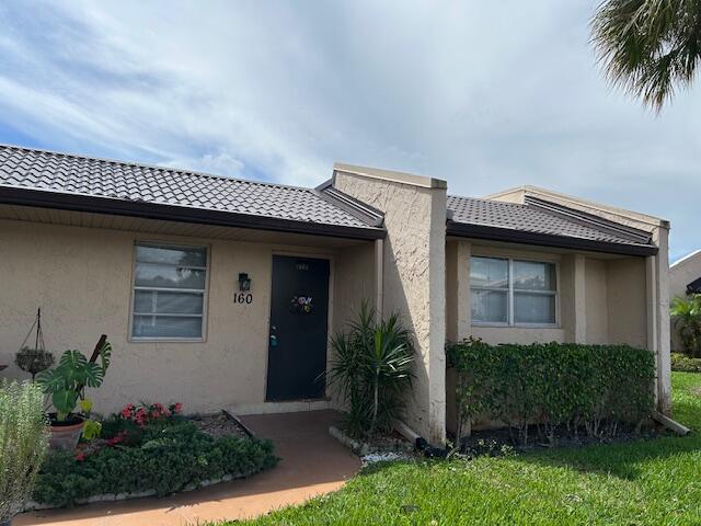 Corner 2/2 Villa.  Update this unit to your own specifications. Large 25' x 6' enclosed patio, New full size washer/dryer. Full time social director schedules shows, trips and event.  24/7 guard gated.  Courtesy bus to grocery store, big box stores etc 5 days a week. Friday is Beach day to Lake Worth Beach.  Internet, Cable TV, water and bldg insurance included in monthly maintenance.  Short walk to the Phase B Clubhouse. Come discover Golden Lakes Village