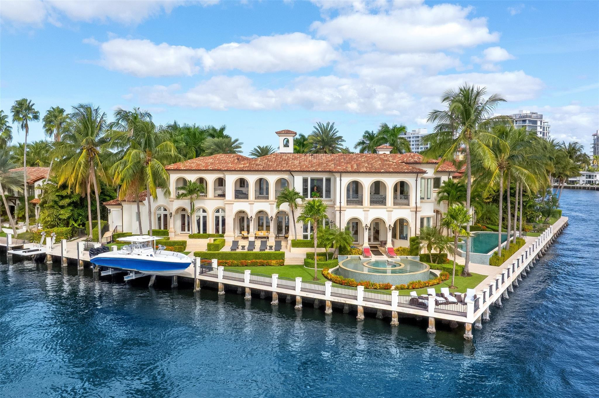 A rare opportunity to own one of Las Olas’ most exceptional point lot estates, offering an impressive +/-330' of prime water frontage, perfect for mega-yacht dockage & panoramic views of the Intracoastal. This Affiniti Architects/Sarkela Corp masterpiece sits on over half an acre, blending timeless architecture & only the finest of finishes w modern amenities. Inside find elegant marble flooring, grand entertaining spaces & water views from every room. Designed for the true entertainer, the property includes a sauna, movie theater, expansive garage, resort-style pool/spa, summer kitchen & expansive outdoor covered living areas surrounded by lush tropical landscaping. An extraordinary combination of land, water and craftsmanship, just moments from FTL Beach and Las Olas Boulevard.