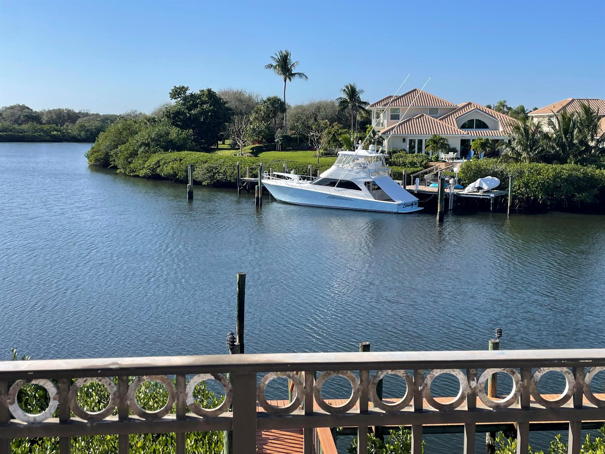 Nestled within the prestigious Barrows Island community of Jonathan's Landing in Jupiter, FL, this meticulously maintained home offers unparalleled waterfront living. Boasting over 3800 sq. ft. of luxurious living space, this residence features a chef-caliber kitchen and water frontage on a private, protected canal, making it a true boater's paradise. Enjoy direct access to the Intracoastal Waterway and close proximity to the Jupiter Inlet. The inviting living area opens to a patio, seamlessly blending indoor and outdoor living spaces. The Florida lifestyle is epitomized with a stunning inground pool, perfect for both relaxation and entertainment. Combining luxury, comfort, and convenience, this home is situated in one of Jupiter's most sought-after locations, offering a truly exceptional living experience.