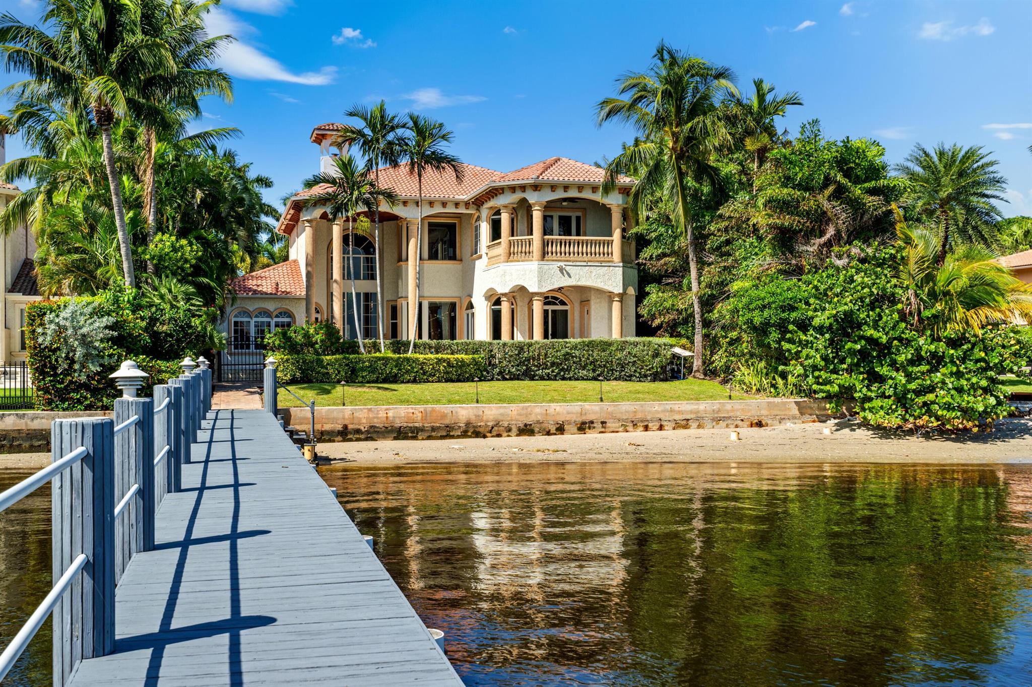 Evoking the timeless allure of classic European architecture, this direct-Intracoastal masterpiece showcases unparalleled quality and attention to detail along with dynamic water views from all main rooms. Decorative appointments include marble and pecky-cypress. Indoor/outdoor living is exceptional, with two loggias, large pool, private beach, and dock accommodating up to a 50-foot boat. LOCATION: 

318 South Lake Drive, Lantana, Florida: Striking a balance between the tranquil allure of the ocean and the vibrancy of an active lifestyle, Lantana is a charming coastal town lauded for its pristine beaches, diverse range of upscale amenities, and keen sense of community.

PROPERTY: 
 
Completely walled with a perimeter visual monitoring system and an electric gate offering privacy and security, the large brick-paved motor court, shaded by beautiful mature trees, fronts the residence and three-car garage. Highlighted by a private beach with 76 feet directly on the Intracoastal, the residence's outdoor entertaining spaces invite the coveted outdoor/indoor waterfront-style of living. The two-story loggia, off the salon, with a summer kitchen and grill, as well as a smaller loggia, accessed from the great room, overlook the heated salt-chlorination pool with a spill over spa. Perfect for watersport enthusiasts, the full-service dock can accommodate up to a 50-foot vessel, and an additional advantage, the property offers easy an approach to the ocean with no fixed bridges. Added conveniences are a cabana bath and an outdoor shower.  

RESIDENCE:  

Evoking the timeless allure of classic European architecture, this direct-Intracoastal six-bedroom masterpiece, with 7,029 +/- total square feet, conveys unparalleled quality and attention to detail combined with dynamic water views from all the main rooms. The grand two-story atrium entry, showcasing stone-finished walls and a dramatic marble staircase, immediately dazzles, while the double-height mezzanine-style salon, appointed in marble and pecky cypress, impresses. Serving as a sensational focal point, the salon's magnificent gas fireplace is embellished by a massive carved coral-stone mantel bookended by art alcoves. The dining room, an intimate space, is crowned by a decorative ceiling and offers pretty garden views, while the epicurean kitchen is centered on an oversized chef's workstation island and an eat-in bar with pull-up seating that invites casual entertaining. Fitted with professional-grade appliances, granite counters, custom wood cabinetry and a pantry, the kitchen connects to the water-view great room featuring a coffered ceiling, the breakfast bay overlooking the pool and Intracoastal, and the full-service wet bar with a wine cooler. Completing the first-floor layout are four guest bedroom suites, with one finished with bookcases and currently serving as a library. The stairway just off the foyer, and elevator, that is nestled in the laundry room, ascend to the multi-purpose game room/office and the primary suite. A serene retreat, the expansive primary bedroom features wood flooring, a pecky-cypress ceiling, French doors that open to an Intracoastal-view private balcony, and a bay sitting area. The suite comprises two custom-fitted walk-in closets and a spa-inspired bathroom appointed with marble and granite and fitted with custom cabinetry, dual sinks, a shower, Jacuzzi tub and two water-closets. Completing the floorplan is a laundry, and amenities throughout include a whole house gas generator, gas accommodation, water-filtration system, central-vacuum system and impact-glass windows and doors. Truly a must-see trophy property, this remarkable estate is a sublime study in timeless luxury, sophistication and ease.


DISCLAIMER: Information published or otherwise provided by the listing company and its representatives including but not limited to prices, measurements, square footages, lot sizes, calculations, statistics, and videos are deemed reliable but are not guaranteed and are subject to errors, omissions or changes without notice. All such information should be independently verified by any prospective purchaser or seller. Parties should perform their own due diligence to verify such information prior to a sale or listing. Listing company expressly disclaims any warranty or representation regarding such information. Prices published are either list price, sold price, and/or last asking price. The listing company participates in the Multiple Listing Service and IDX. The properties published as listed and sold are not necessarily exclusive to listing company and may be listed or have sold with other members of the Multiple Listing Service. Transactions where listing company represented both buyers and sellers are calculated as two sales. "No payments made until title passes" Some affiliations may not be applicable to certain geographic areas. If your property is currently listed with another broker, please disregard any solicitation for services. Information published or otherwise provided by seller, listing company or its representatives is deemed reliable but are not guaranteed and subject to errors, omissions, or changes without notice. Copyright 2025 by the listing company. All Rights Reserved.