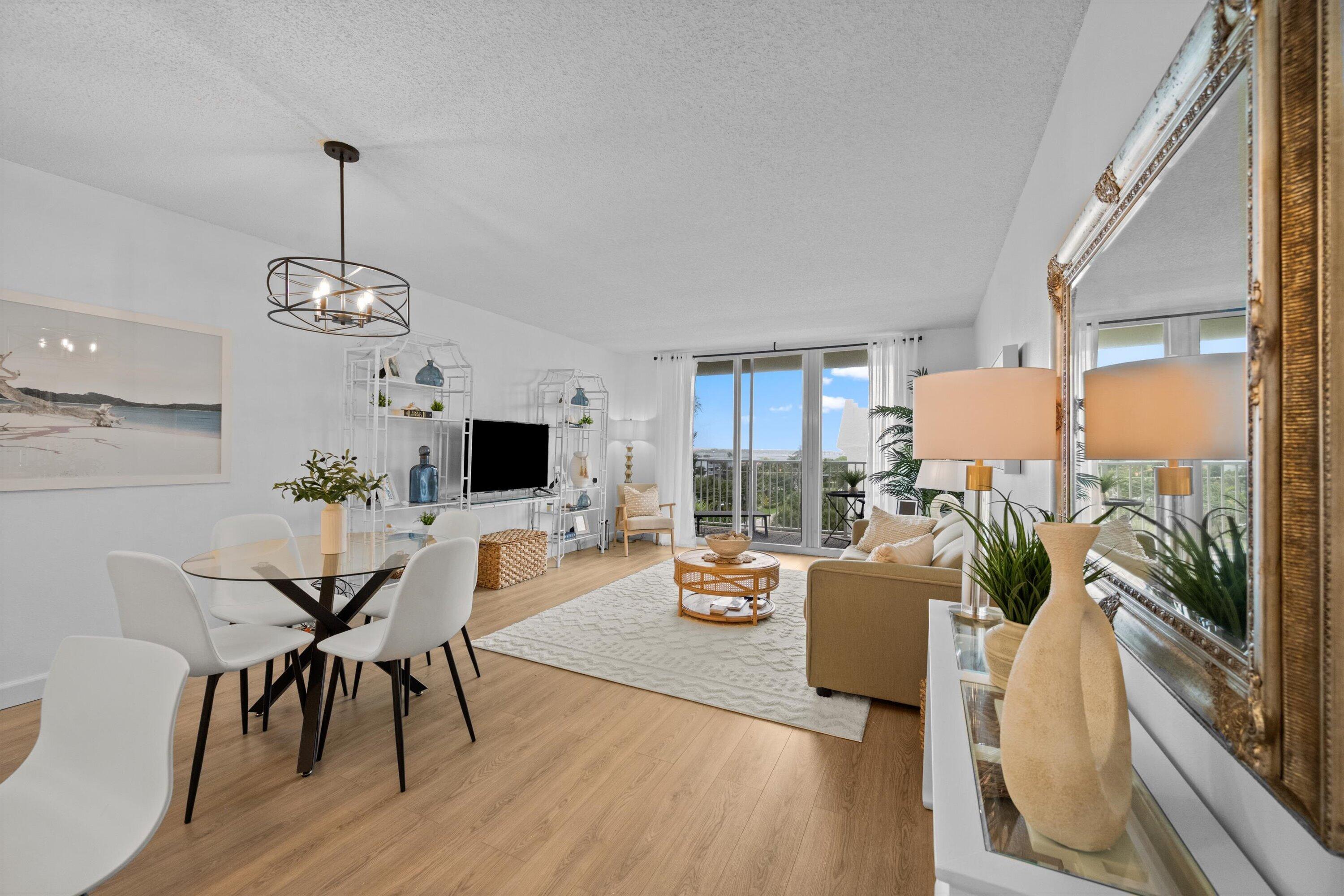 Available for seasonal lease in the highly sought-after Le Chateau on South Palm Beach Island, this beautifully updated corner residence offers an open-concept layout designed for effortless coastal living. The home features a modern kitchen with quartz countertops and stainless steel appliances that seamlessly flows into the living and dining areas, creating a bright and inviting space perfect for entertaining or relaxing. Luxury vinyl plank flooring runs throughout the residence, complemented by beautifully curated furnishings that enhance the sophisticated yet comfortable beachside aesthetic. As a desirable corner unit, the home is filled with natural light and offers added privacy, while the private balcony showcases stunning views of the Intracoastal Waterway and views  of the  Atlantic Ocean. Located in an oceanfront building just steps from the sand, this exceptional residence is ideally positioned minutes from Worth Avenue, Palm Beach International Airport, fine dining, shopping, and all the best of Palm Beach living.