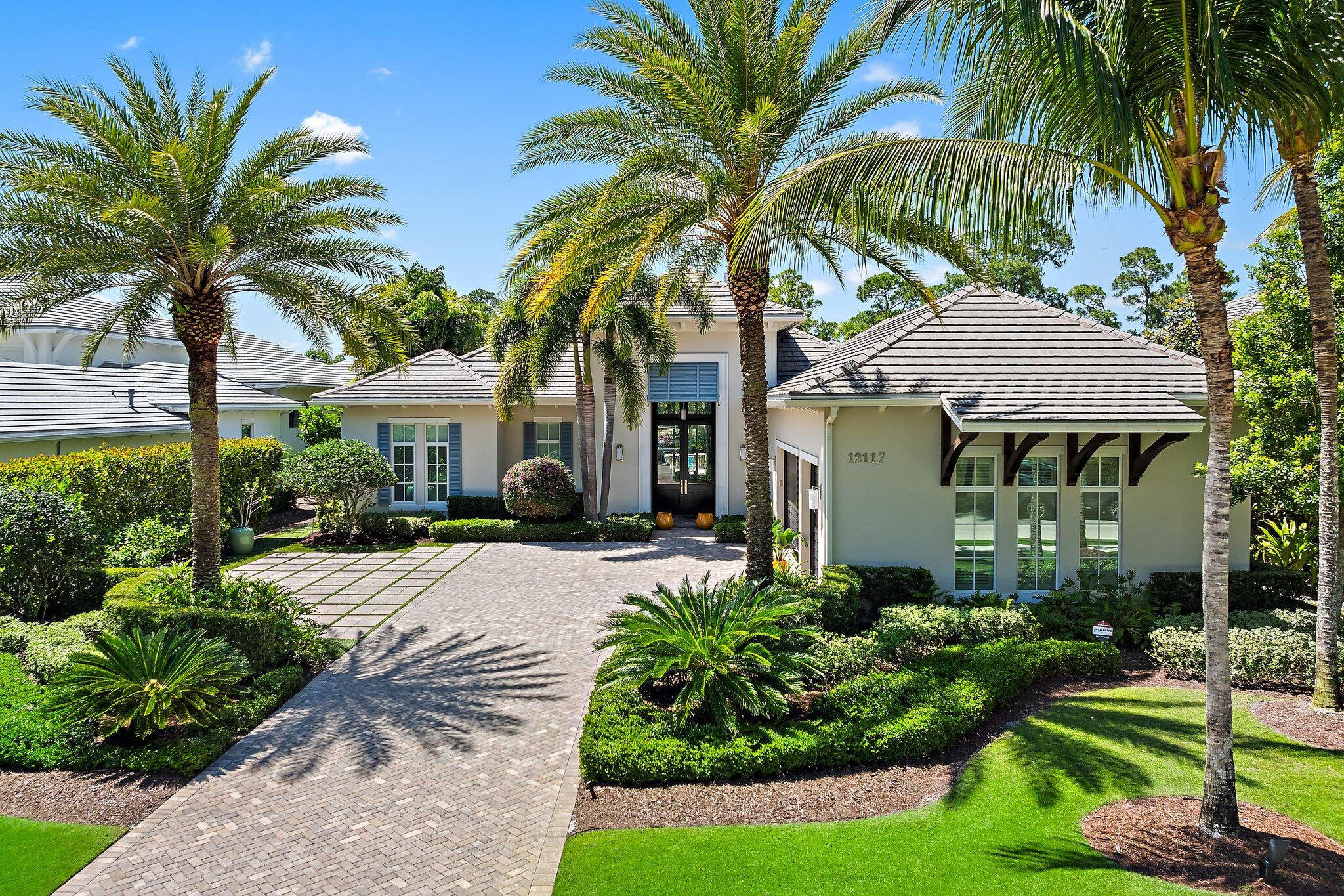 Nestled within the prestigious greens of Old Palm Golf Club, this stunning home is situated on 1/3 acre with a lovely golf view located on the 10th fairway in the sought after Isle Estates. A custom Coquina model meticulously built by Courchene Development and designed by award winning Affiniti Architects.  Beautiful kitchen with transom windows, butlers pantry and Thermidor appliances. The primary bedroom has 2 full baths and 2 spacious closets. All guest rooms are ensuite. Relax outdoors under the covered lanai which is perfectly situated facing the pool and lush landscaped garden for serene alfresco dining. Whole house generator, impact glass windows and doors throughout. Stunning architecture and thoughtful design allows for open, expansive and light-filled spaces. This is a must see! Other custom features include, main flooring 24x24 Antico marble (vanilla shadow Polished.  All new light fixtures, new carpet in all the bedrooms.  All new window treatments drapes and curtains. New solid oak doors in the office.  Remote screens on the covered lanai.  Installed new turf in the back yard. 

Solid Mahogany front entry door
Refrigerator Thermidor 30" 
Freezer Thermidor 18" 
Cooktop Thermidor 36"
Double oven Thermidor 30"
Dishwasher Thermidor 
Microwave Thermidor 24"
Wine cooler U Line 15"
Ice Maker U line 15"
Victoria and Albert tub in her bath
Outdoor fireplace 
6x12 Lime stone pavers on the patio/deck
Ovation kitchen cabinets 
White Macaubas polished Quartzite countertops

Old Palm has an 18-hole championship golf course completely re-designed by Raymond Floyd, with a separate 3 hole practice facility. A new completely renovated clubhouse with 1 bedroom casita's, restaurant, bistro, cafe, fitness center, lap pool, kids club and mens and women's spa. Beach Club is available. 
If you are looking for an exclusive golf course and luxurious home in Palm Beach Gardens, Old Palm Golf Club is one of the most desired choices.