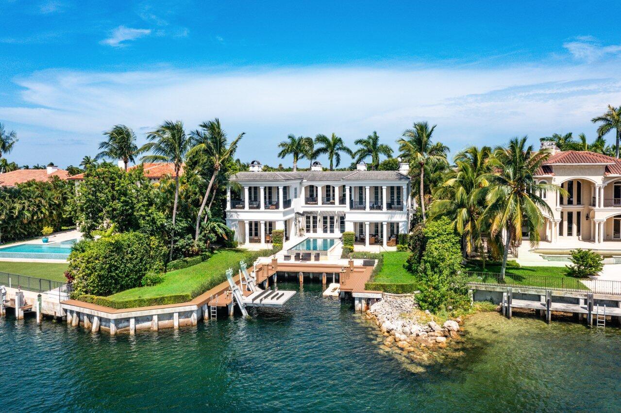 Welcome to this extraordinary private, gated waterfront estate, nestled within Boca Raton's most prestigious enclave. This one-of-a-kind custom home offers an unparalleled South Florida lifestyle with over 90± feet of direct frontage on the INTRACOASTAL Waterway. Step inside and discover a grand 5-bedroom, 6 full and 3 half-bathroom residence designed for ultimate luxury. Highlights include a stunning gourmet kitchen equipped for a chef, a private ELEVATOR, and expansive living spaces perfect for both relaxing and entertaining. Outdoors, indulge in resort-style amenities with an INFINITY swimming pool overlooking the serene waterway, and a private dock accommodating two vessels, making it a boater's dream. This exquisite estate represents the pinnacle of Boca Raton livingdon't miss the opportunity to enjoy this exclusive and lavish lifestyle.