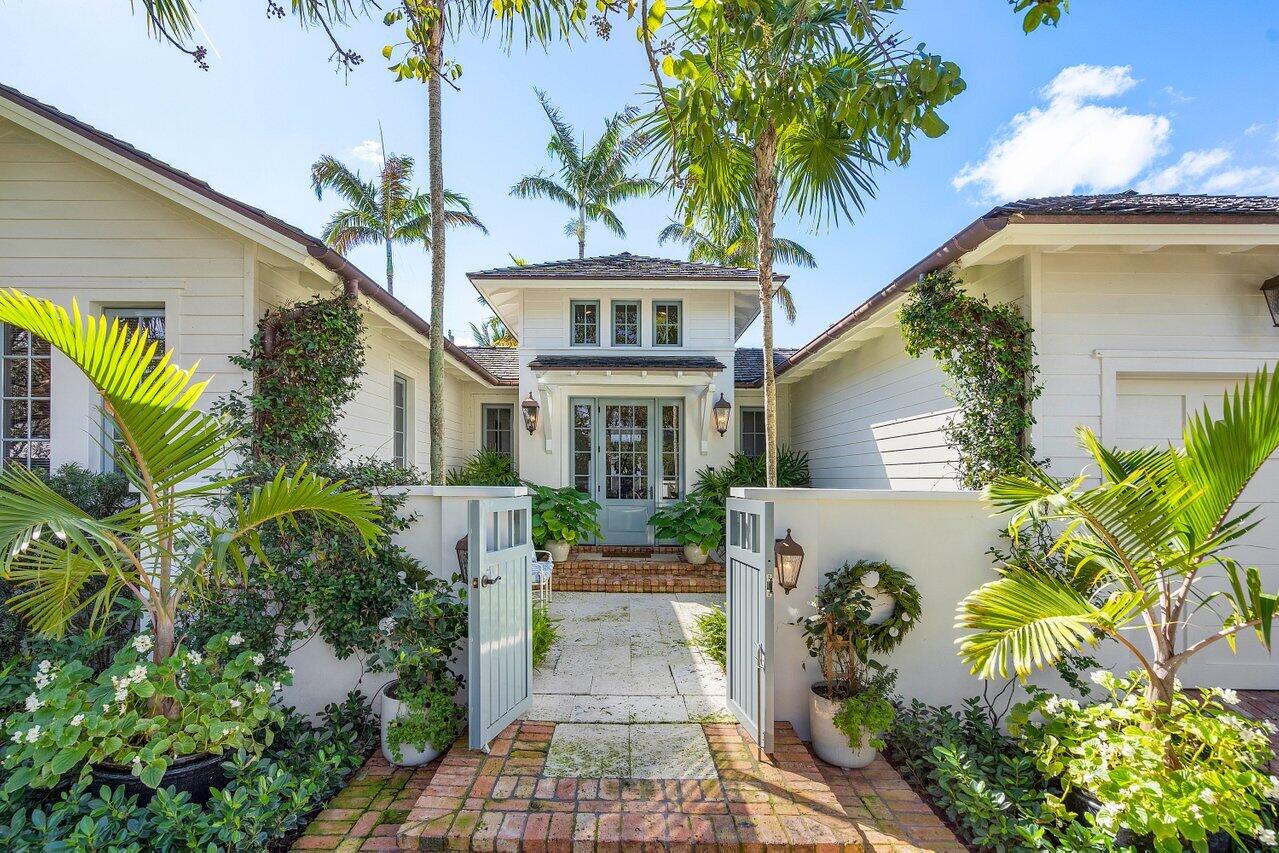 An oasis of exclusive luxury and sophisticated interiors, this elegant single-family home at 1102 N Vista Del Mar, Delray Beach, offers the quintessential Floridian lifestyle in a sought-after location, just mere steps from the beach and celebrated Atlantic Avenue. Created with exceptional materials and built with outstanding craftsmanship by SRD, a distinguished builder, this light-filled, courtyard-style residence offers four bedrooms, three bathrooms, and encompasses a total of 3,077 square feet. It presents versatile living spaces including a majestic two-story entrance with an Atrium foyer, a striking great room with high ceilings, and French doors that reveal a captivating courtyard with a gas fireplace, covered loggia, and pool, all set against a backdrop of natural coral stone and lush greenery, emanating serenity and tranquility. The custom-crafted open kitchen is a dream for culinary enthusiasts, featuring top-tier appliances, an expansive workspace, and a walk-in pantry. The spacious primary suite provides a tranquil haven with a large walk-in closet and a sumptuous bath with a standalone tub and shower. The three additional bedrooms serve as cozy retreats for guests and families alike. Further enhancing the home's charm are solid walnut wood floors, wood ceilings, and Kolbe impact-resistant windows and doors, to highlight a few. The residence's proximity to both Ft. Lauderdale and Palm Beach International Airports, along with the quaint boutiques and exquisite dining options on Atlantic Avenue, heightens the property's appeal. Whether one is in pursuit of tranquility within a lush beach area setting or the lively atmosphere of a bustling coastal city, 1102 N Vista Del Mar offers a seamless blend of sophistication, privacy, and convenience. Welcome to Vista Del Mar where each day is an experience of unparalleled refinement.