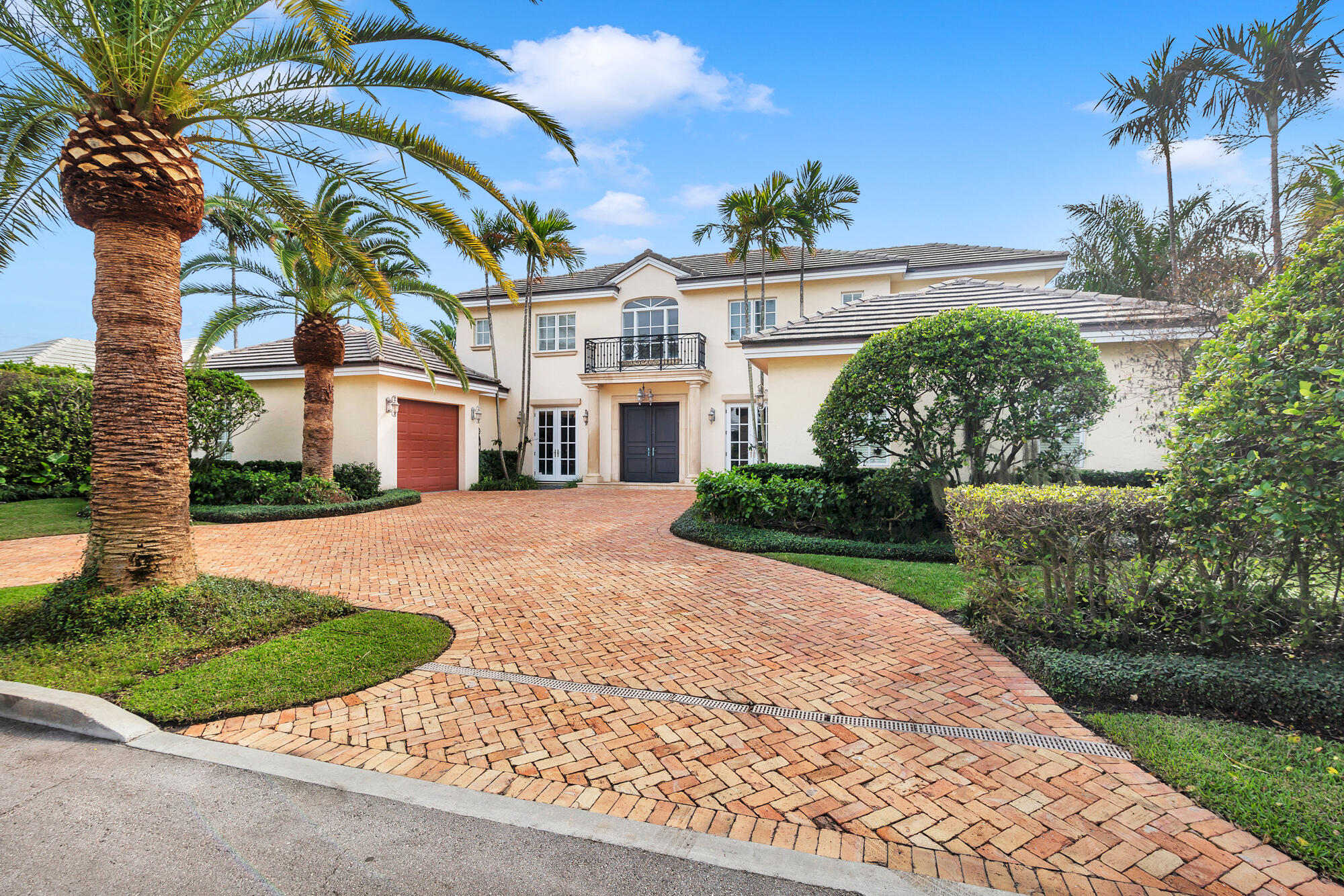 Perfectly located north end residence, with shared ocean beach access.  Enjoy this 4 bedroom and 4.2 bath, 5,000 sq.ft. residence now or re-imagine it with your own touches.  The backyard has a tropical vibe with mature plantings, colorful bougainvillea, and a heated pool and spa.  Inside features include a main level primary suite with adjacent office, custom kitchen with granite counters, butler's pantry & morning bar, wine closet, mahogany wood floors, and impact windows throughout.  Upstairs is a spacious covered balcony and 3 additional en-suite bedrooms.  This residence is completed by 2 separate attached garages.   This north end Palm Beach residence is a lovely place to start living your Palm Beach lifestyle.