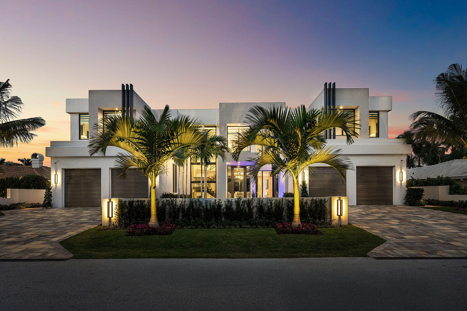 Discover a newly completed signature estate by SRD Building Corp., exquisitely designed by award-winning P&H Interiors, set within the prestigious Royal Palm Yacht & Country Club on an oversized interior lot. This exceptional residence blends architectural precision with curated luxury, offering an elevated lifestyle defined by thoughtful detail and refined craftsmanship. A striking entry reveals an expansive, open layout anchored by a state-of-the-art chef's kitchen with eat-in dining—ideal for both intimate gatherings and elegant entertaining. The sleek clubroom is designed for effortless hosting, featuring a full bar, billiards area, and a glass-enclosed wine room. A private library provides a quiet retreat, while the dramatic show garage--framed by a glass wall--adds a bold architectural statement. The home overlooks the 16th green, creating a picturesque backdrop of manicured fairways and year-round greenery.  Outdoors, a 72-foot lap pool spans the backyard, complemented by a spa, a putting green, and a manicured turf lawn. The covered terrace, complete with a summer kitchen, creates a seamless indoor-outdoor living experience ideal for year-round enjoyment.  The second floor features dual primary suites, each with a private balcony offering serene views over the grounds. Crestron smart-home technology provides intuitive control of lighting, climate, and security throughout. Additional highlights include an elevator, full-house generator, natural gas service, and refined designer finishes throughout.  Buyer is responsible for documentary stamp taxes on the deed and title insurance.