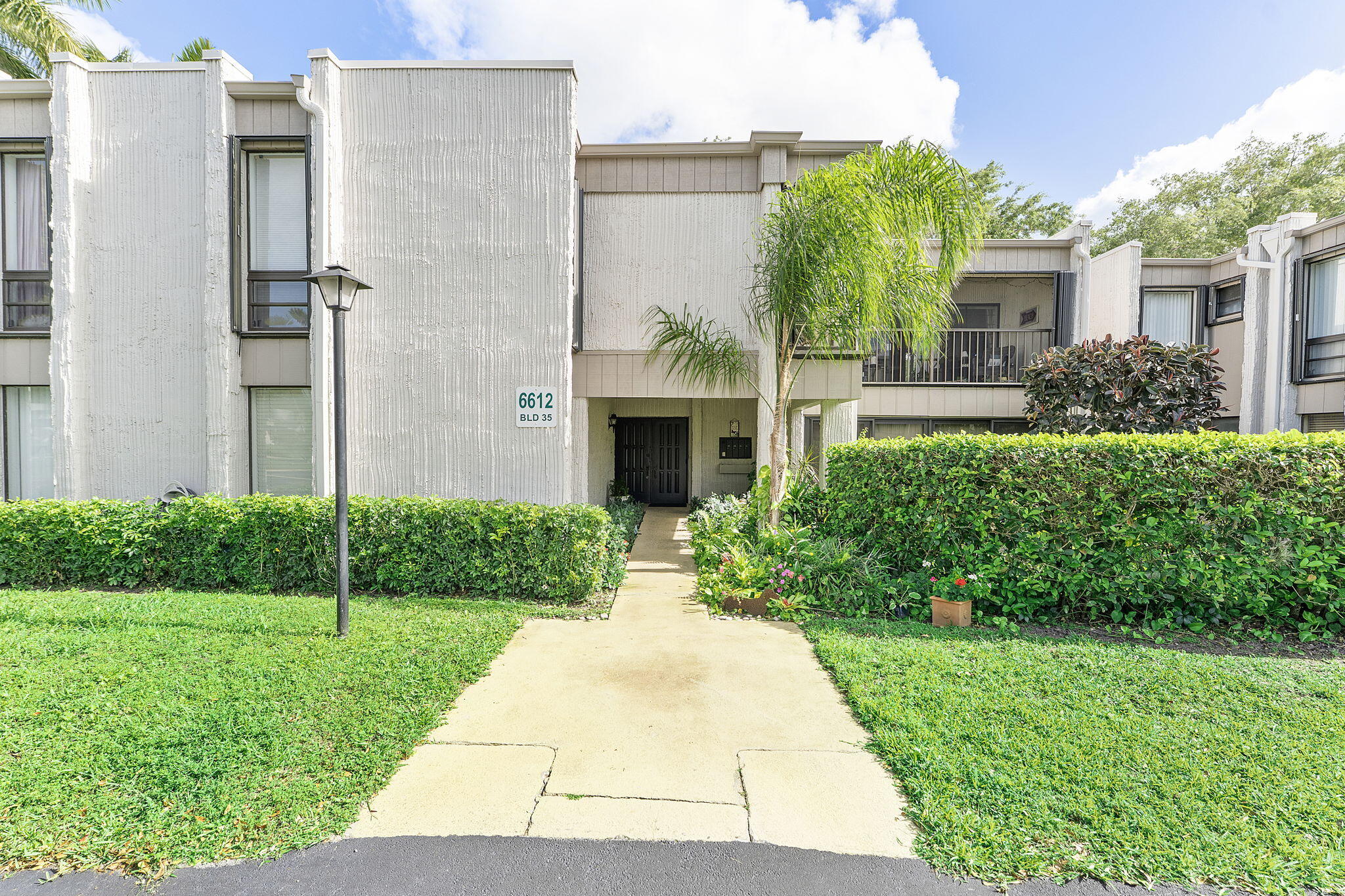 Presenting a well-maintained residence in a quiet 55+ community. This first-floor corner unit offers a spacious 2 bedroom, 2 bathroom layout and is move-in ready. Features include laminate flooring in both bedrooms and tile floors in living area, stainless steel appliances, and an in-unit washer and dryer for added convenience. The community amenities include a clubhouse and two heated pools, with the unit ideally located just steps from the pool area. Conveniently situated near I-95, LA Fitness, Town Center Mall, Publix, YMCA, parks, shopping, and dining, this property offers both comfort and accessibility.